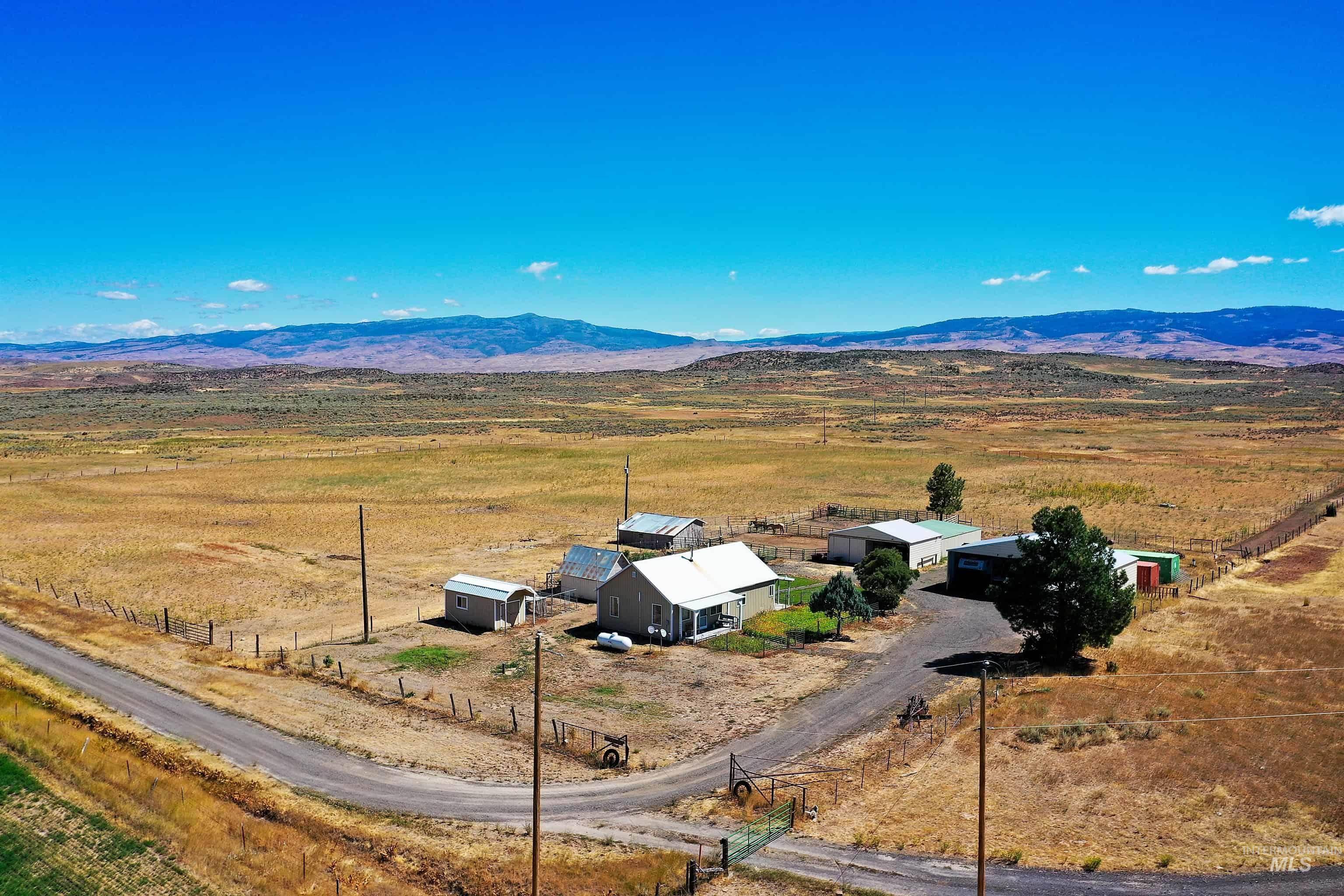 Overview of rural landscape featuring a mountain backdrop