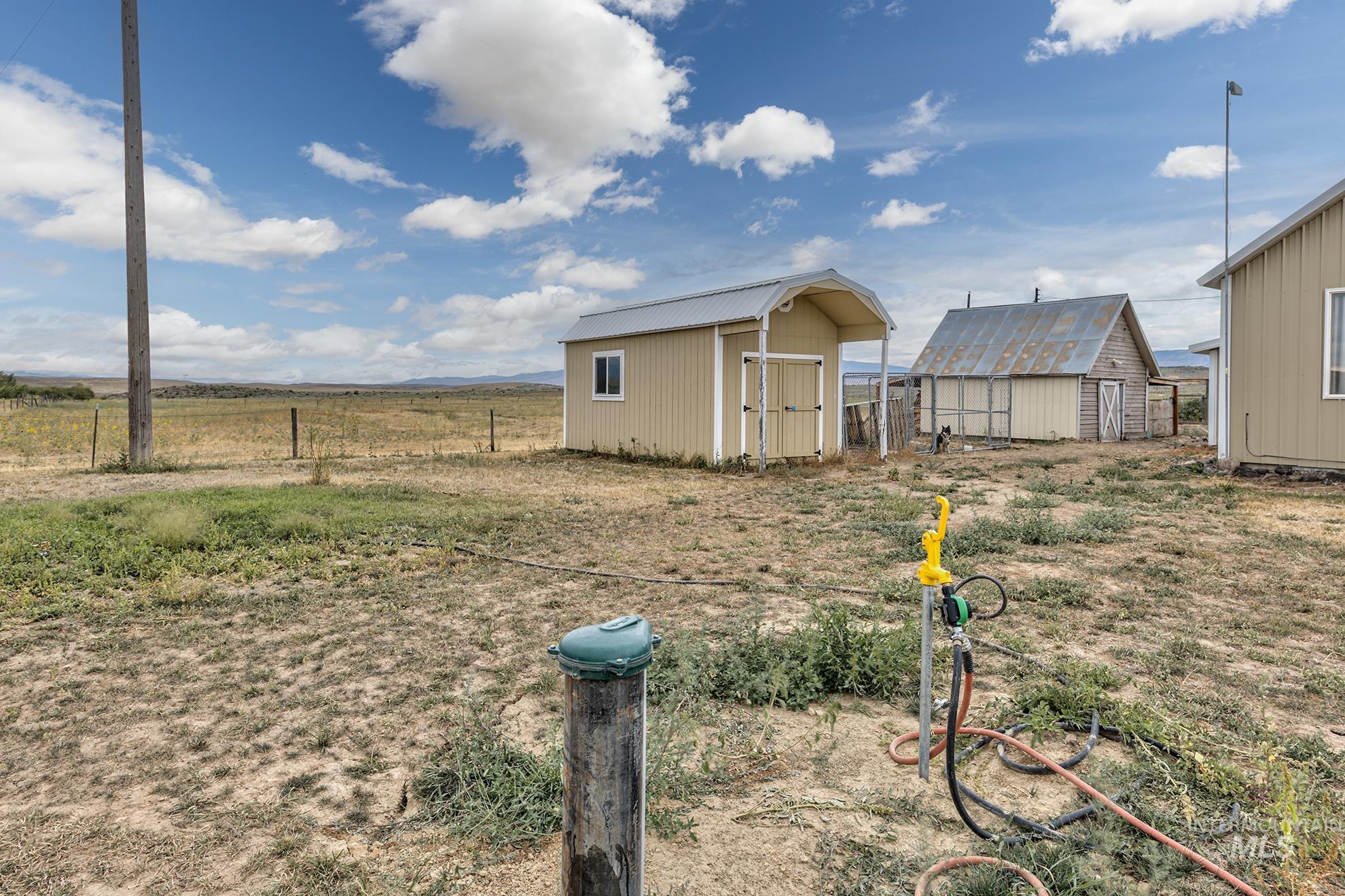View of yard with a storage unit
