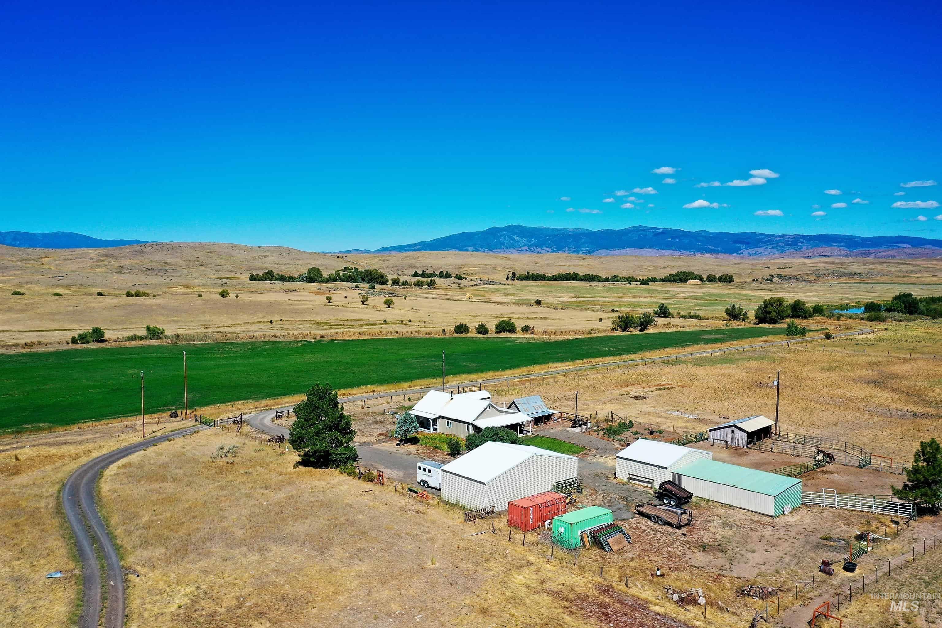 Aerial view of sparsely populated area featuring a mountainous background