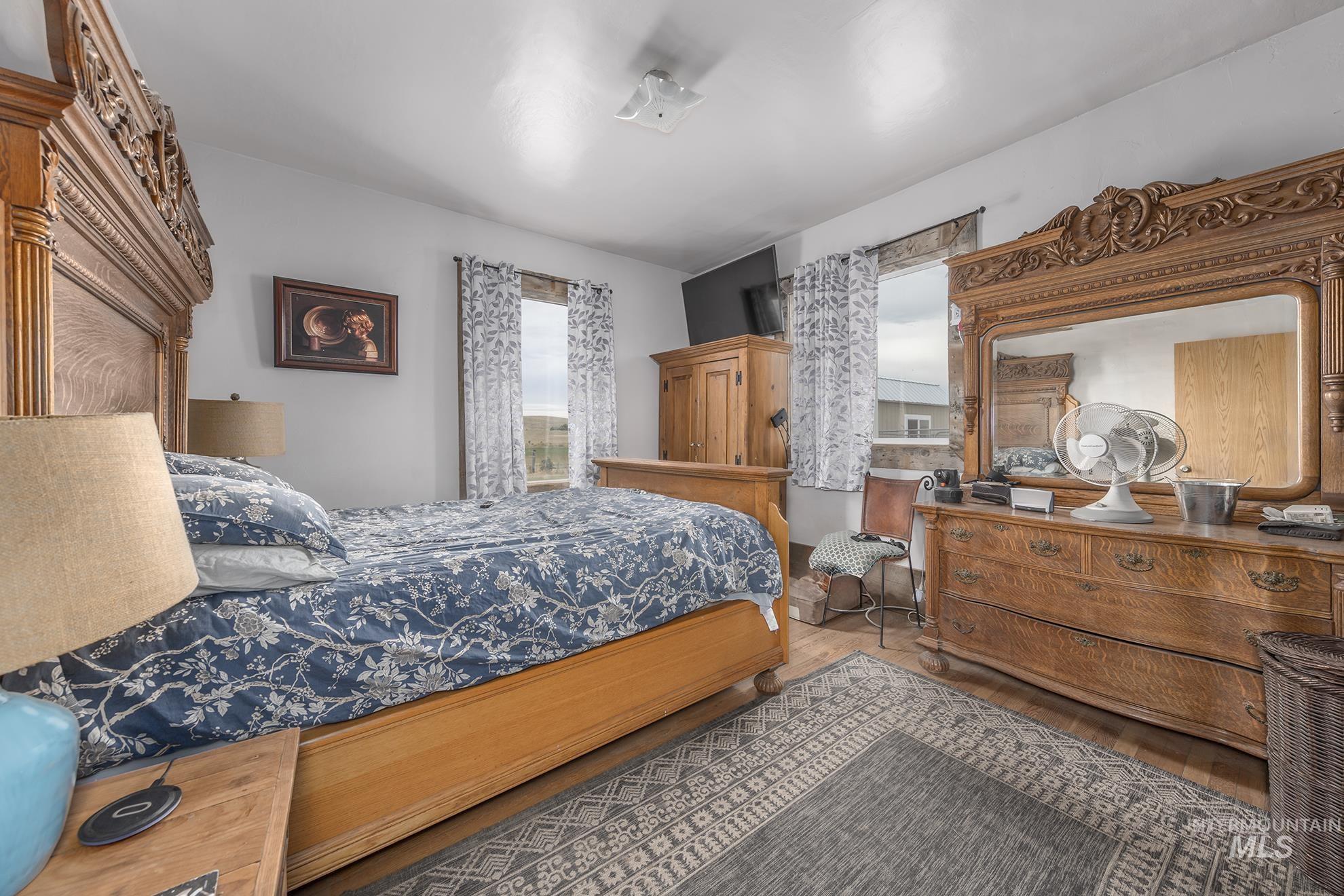 Bedroom with wood finished floors