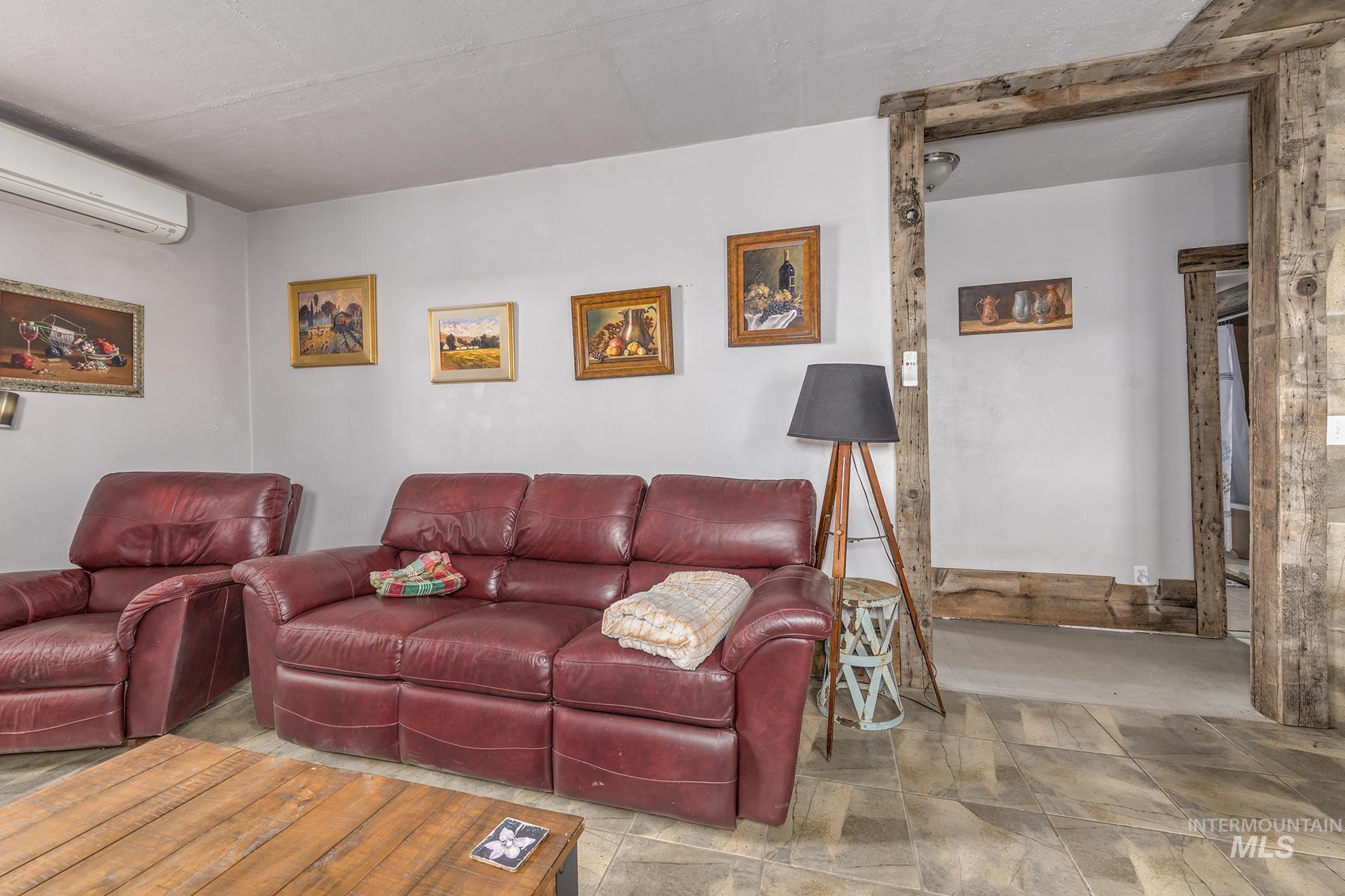Living room featuring a wall unit AC