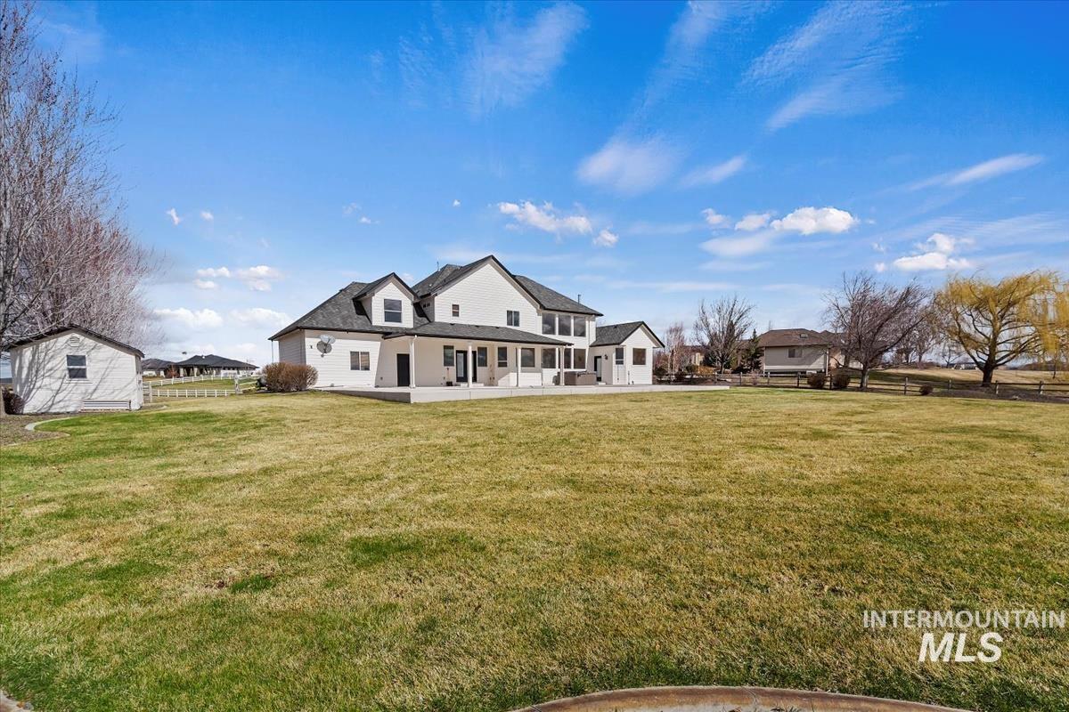 Back of property with a porch