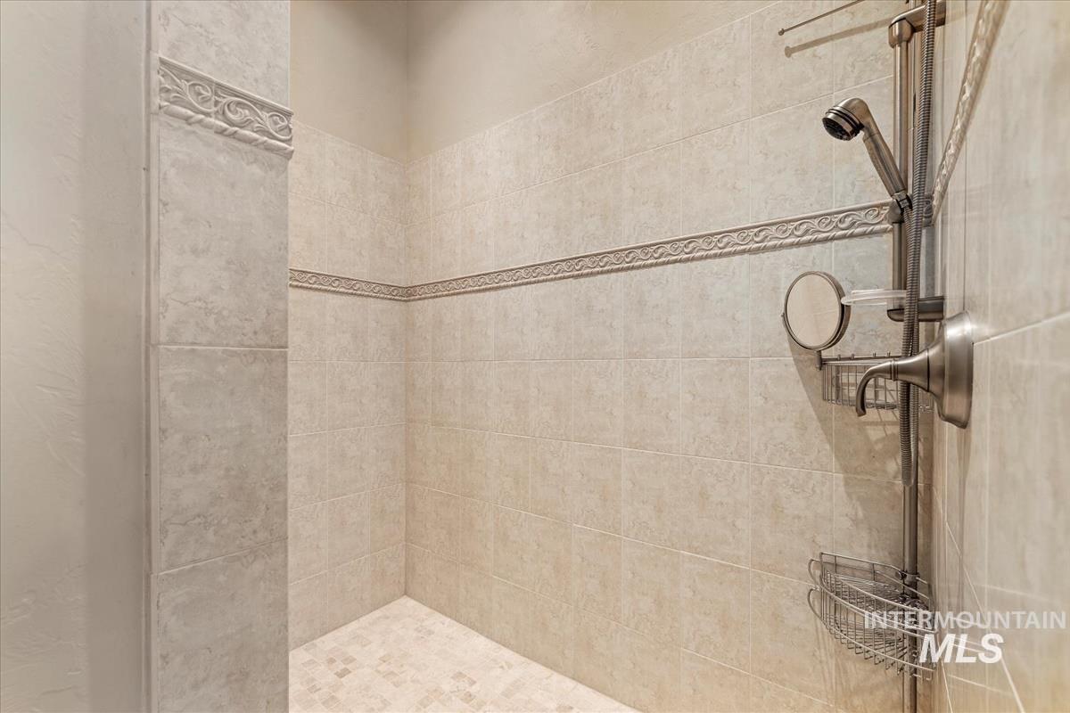 Full bathroom featuring tiled shower