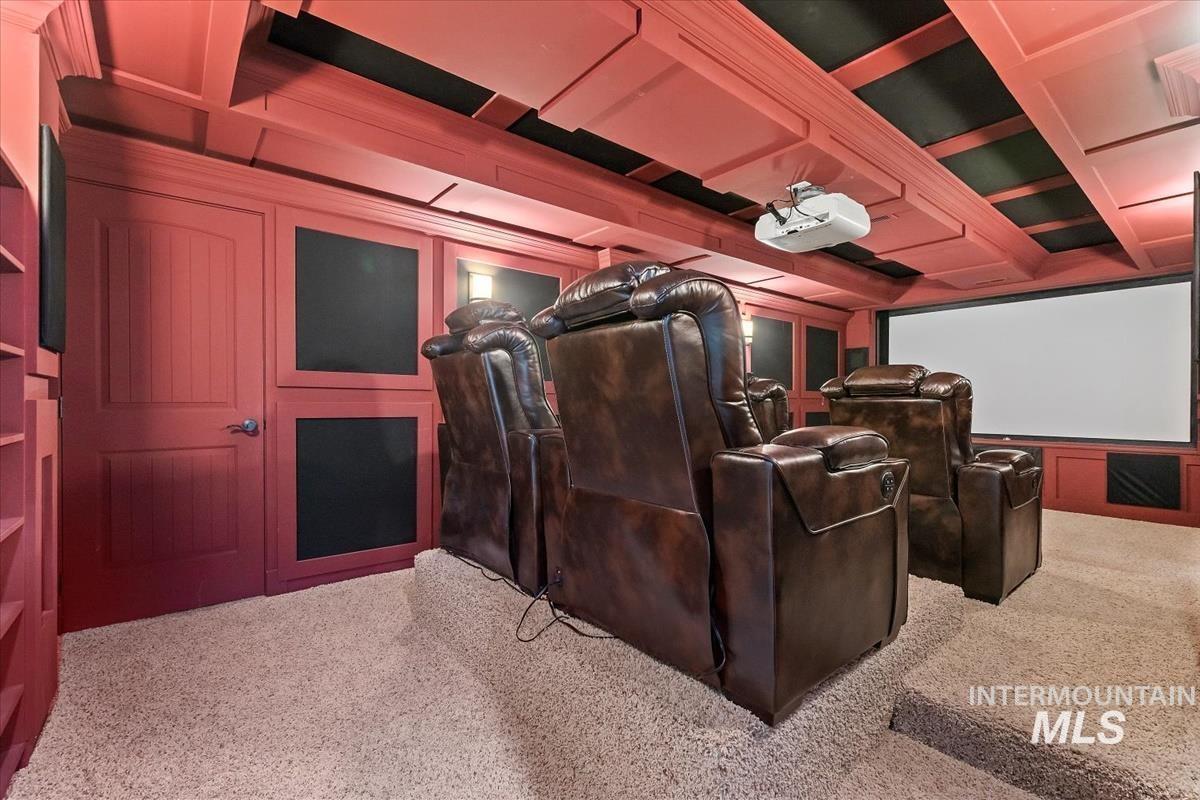 Home theater featuring light carpet
