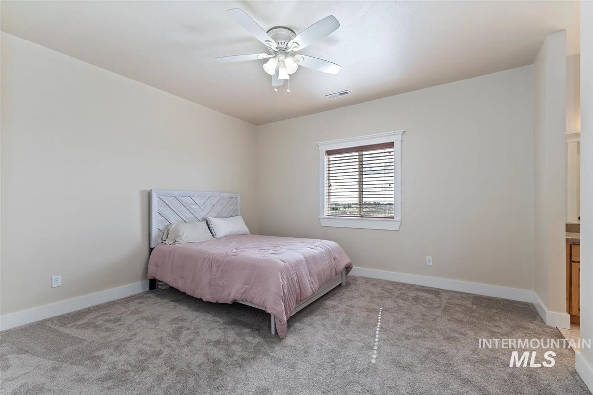 Bedroom with carpet floors and ceiling fan