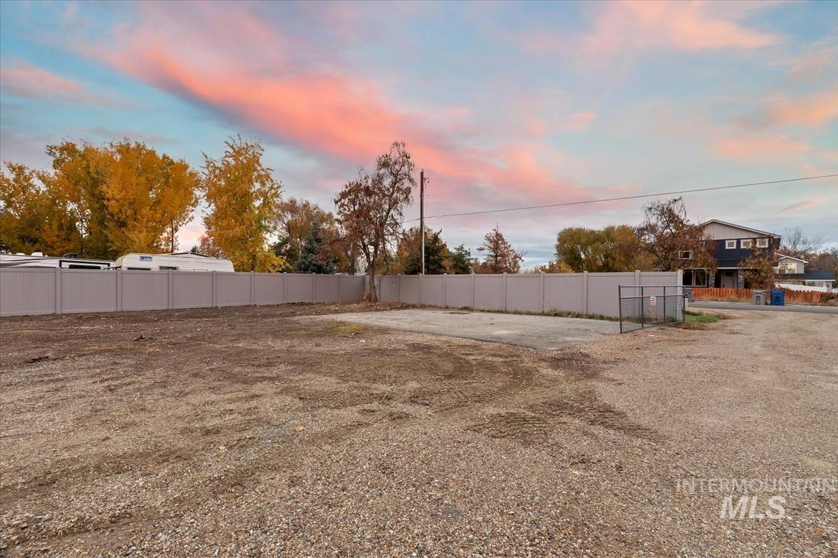Yard at dusk with a patio area