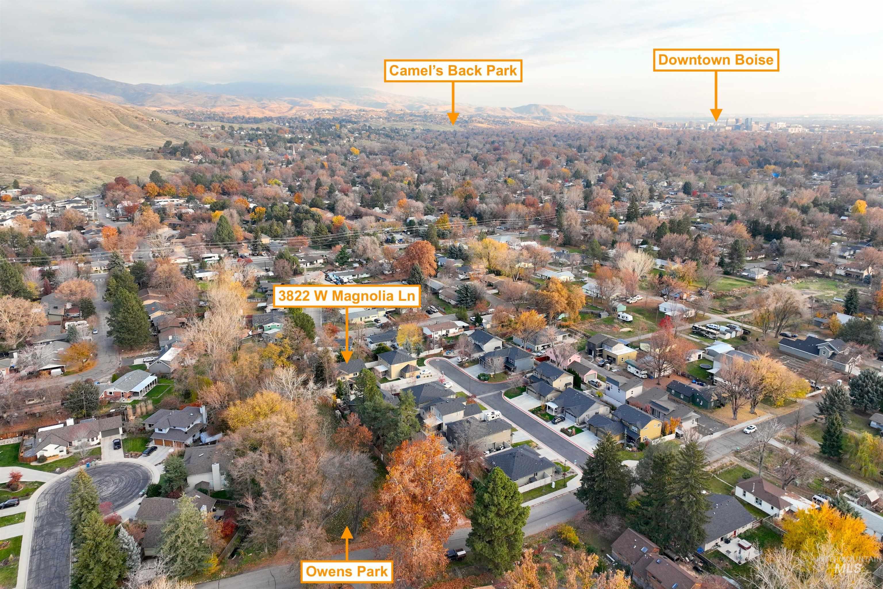 View of property location featuring nearby suburban area and a mountain backdrop
