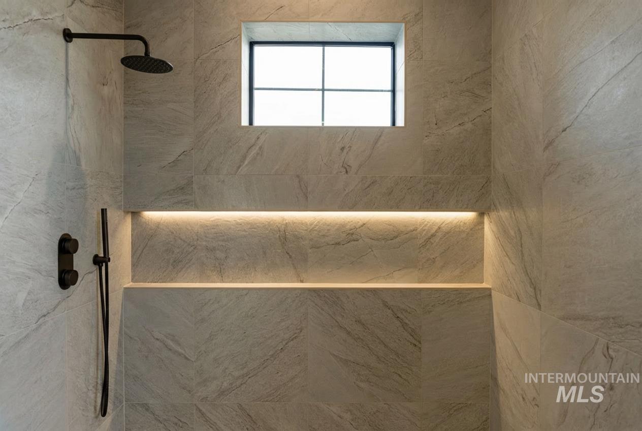 Jr Suite Bathroom featuring a tile shower - Main floor