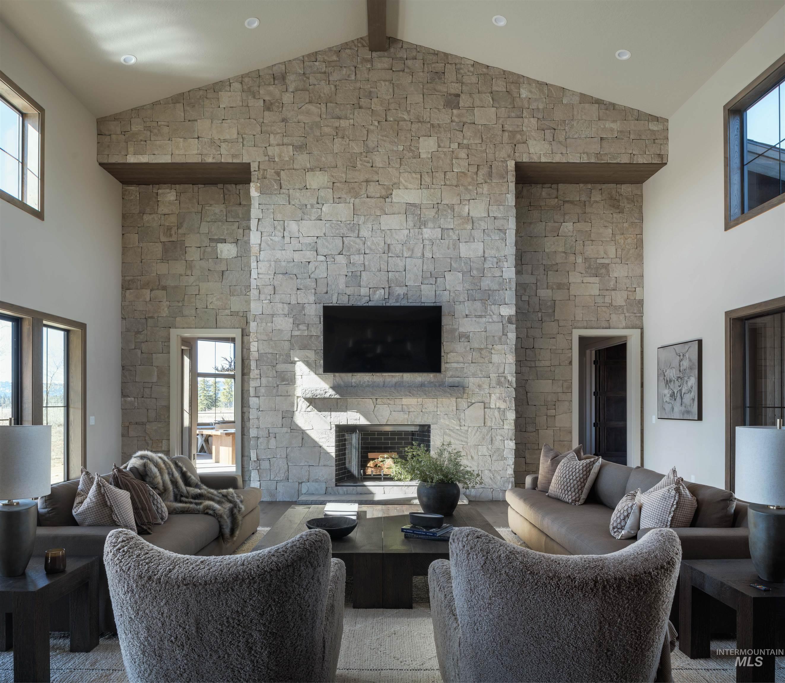 Living area with a fireplace and healthy amount of natural light