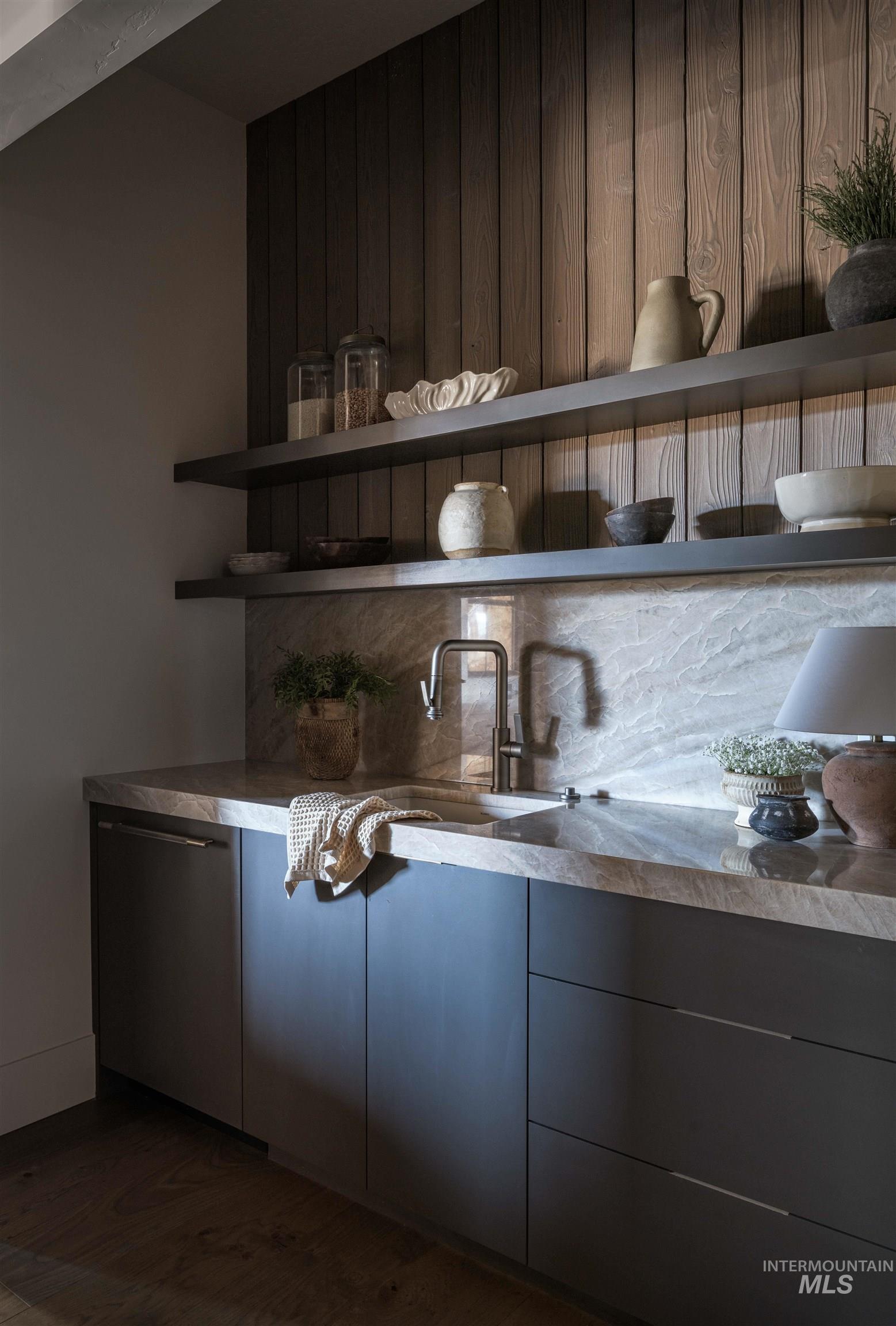 Bar with open shelves, stainless steel dishwasher, dark wood-style flooring, and modern cabinets