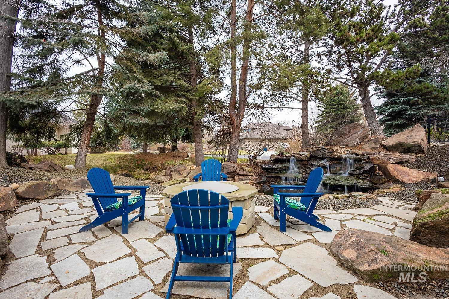View of patio featuring an outdoor fire pit