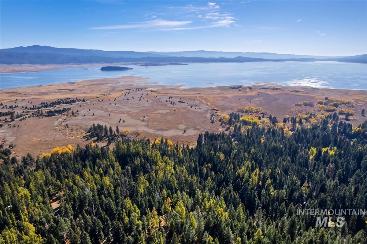 Aerial overview of property's location with a water and mountain view