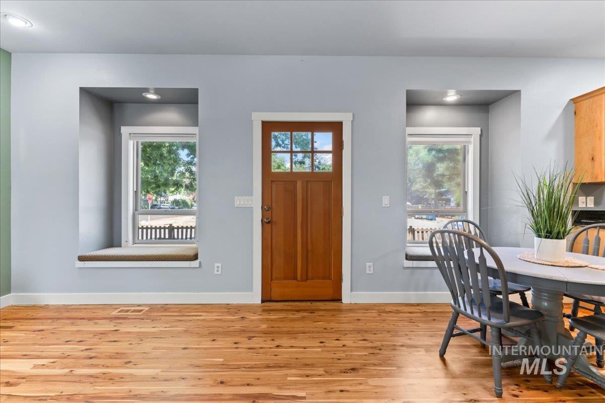 Entrance foyer with plenty of natural light, light wood finished floors, and recessed lighting
