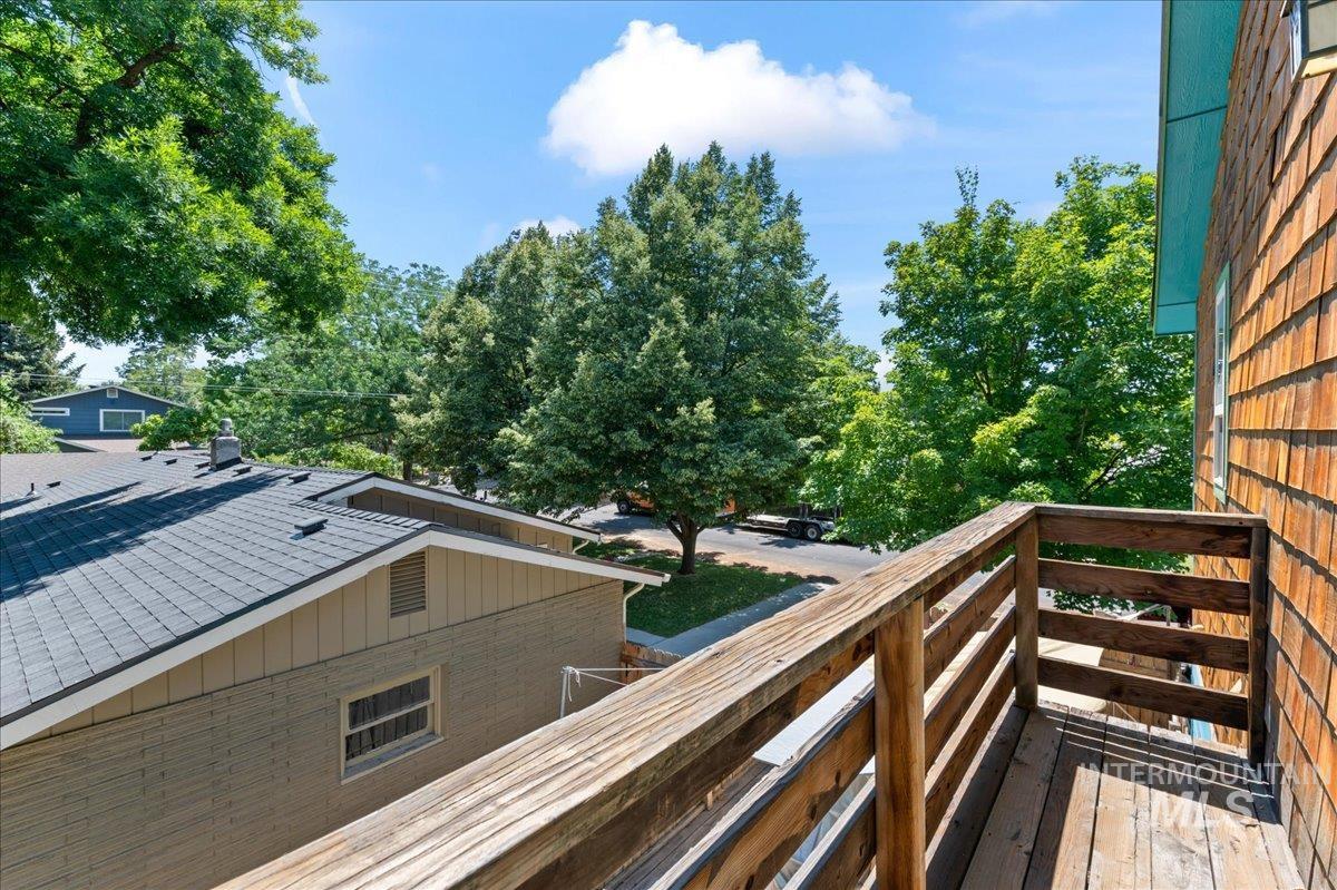 Deck featuring view of scattered trees