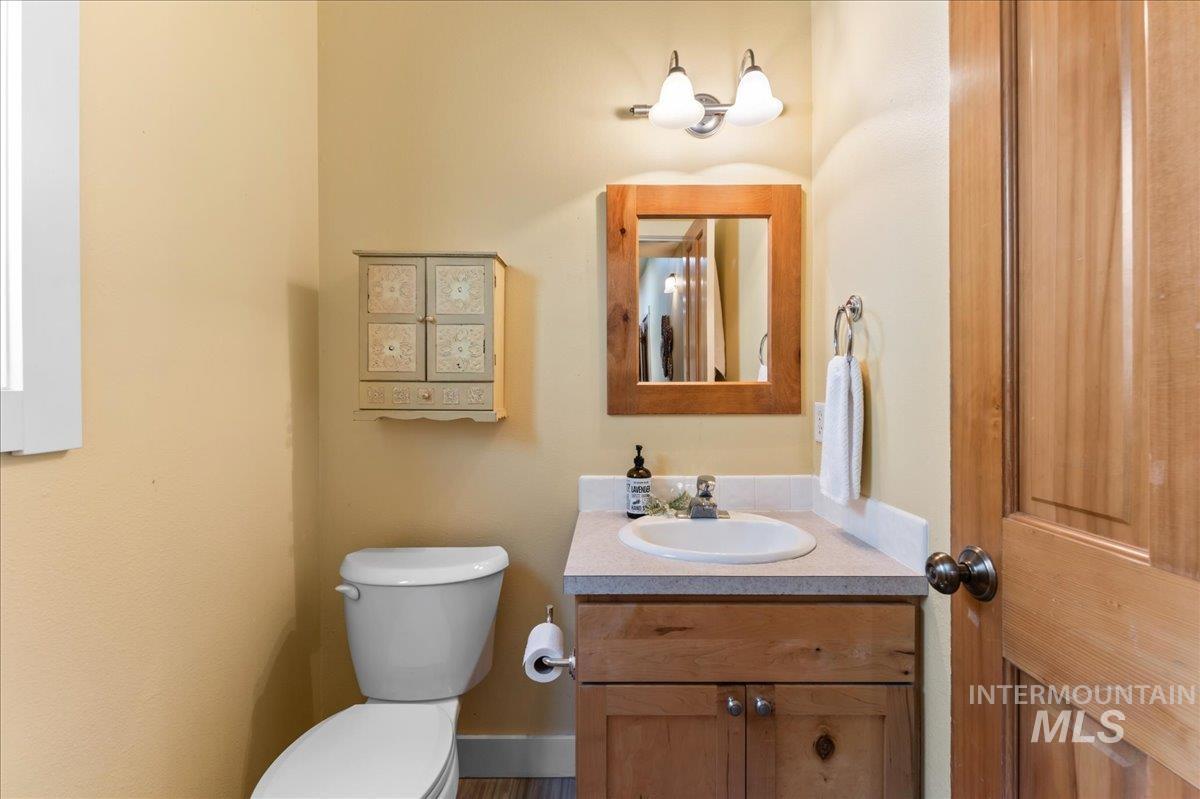 Half bath with vanity and toilet