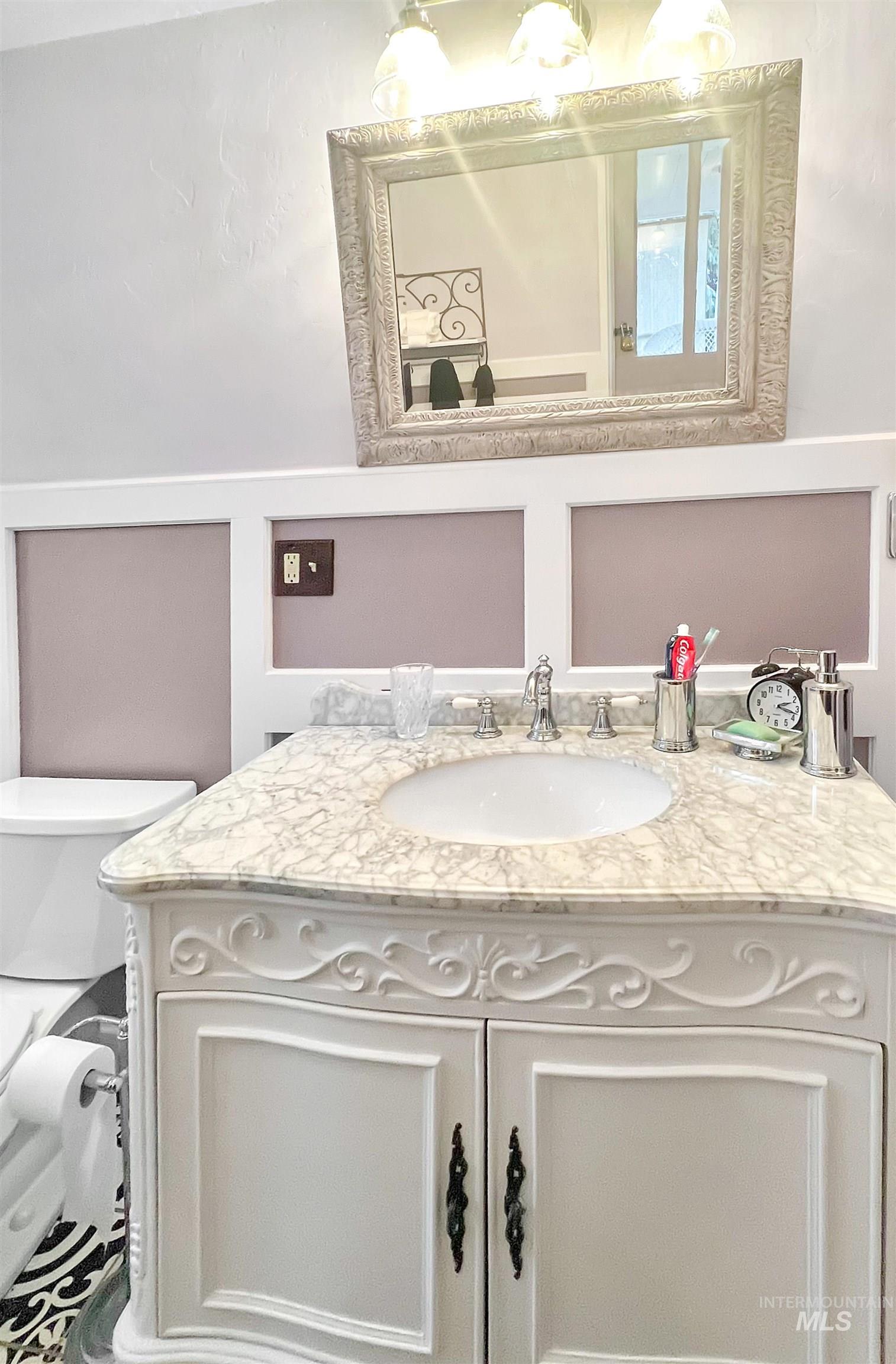 Bathroom featuring toilet and vanity