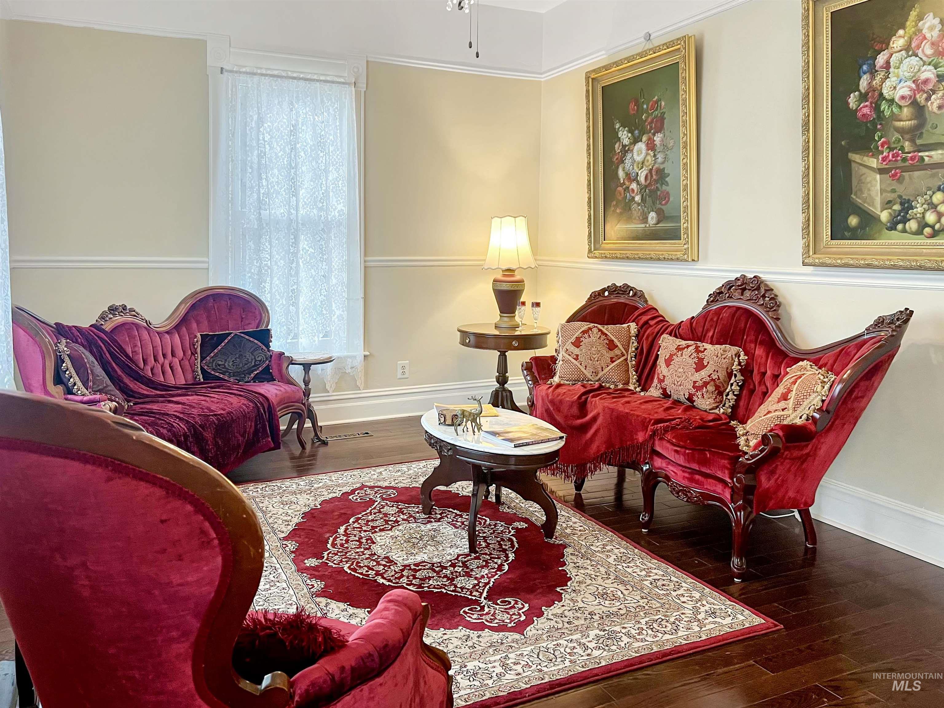 Living area featuring dark wood-style flooring