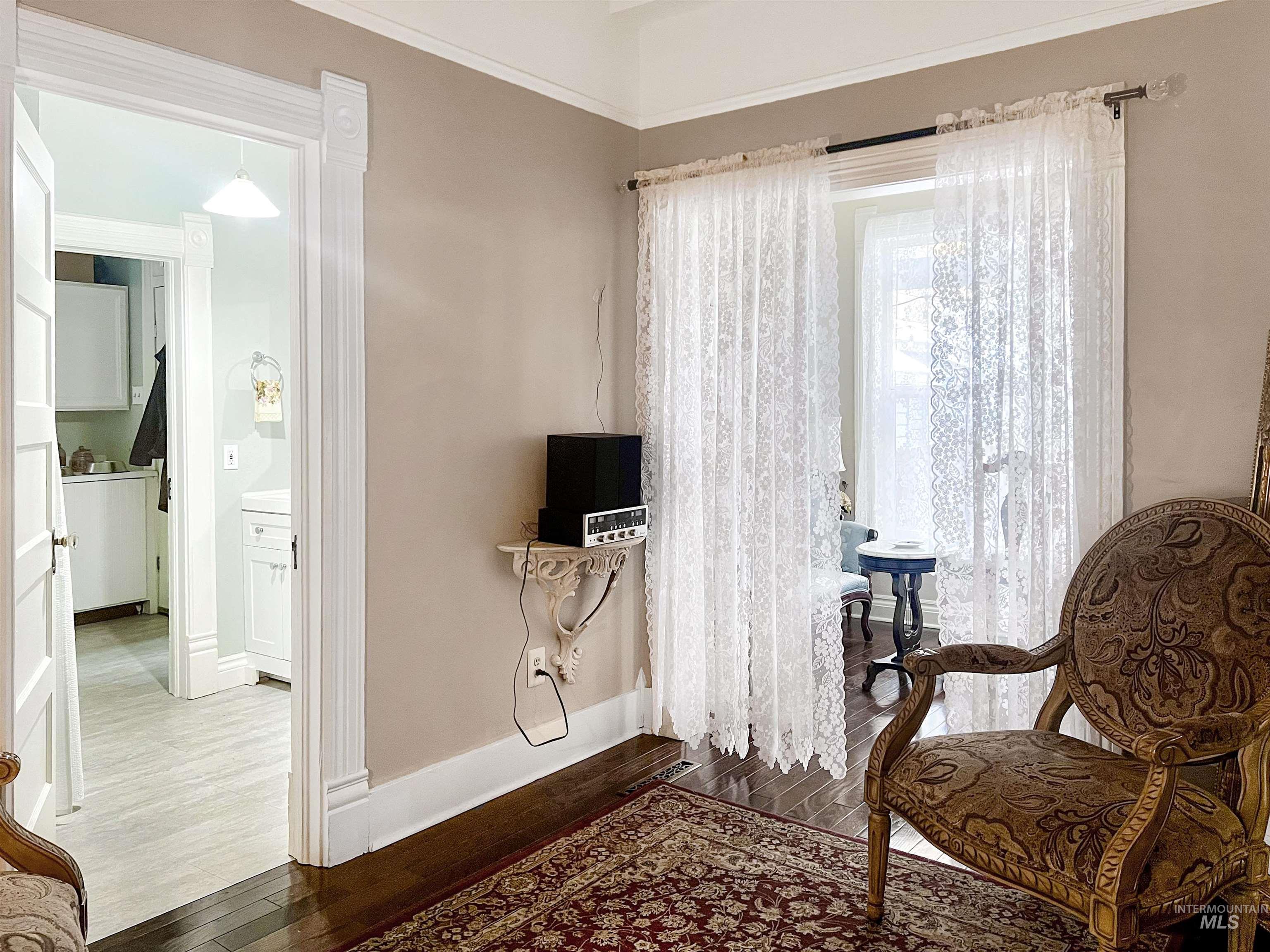 Bedroom featuring dark wood finished floors.