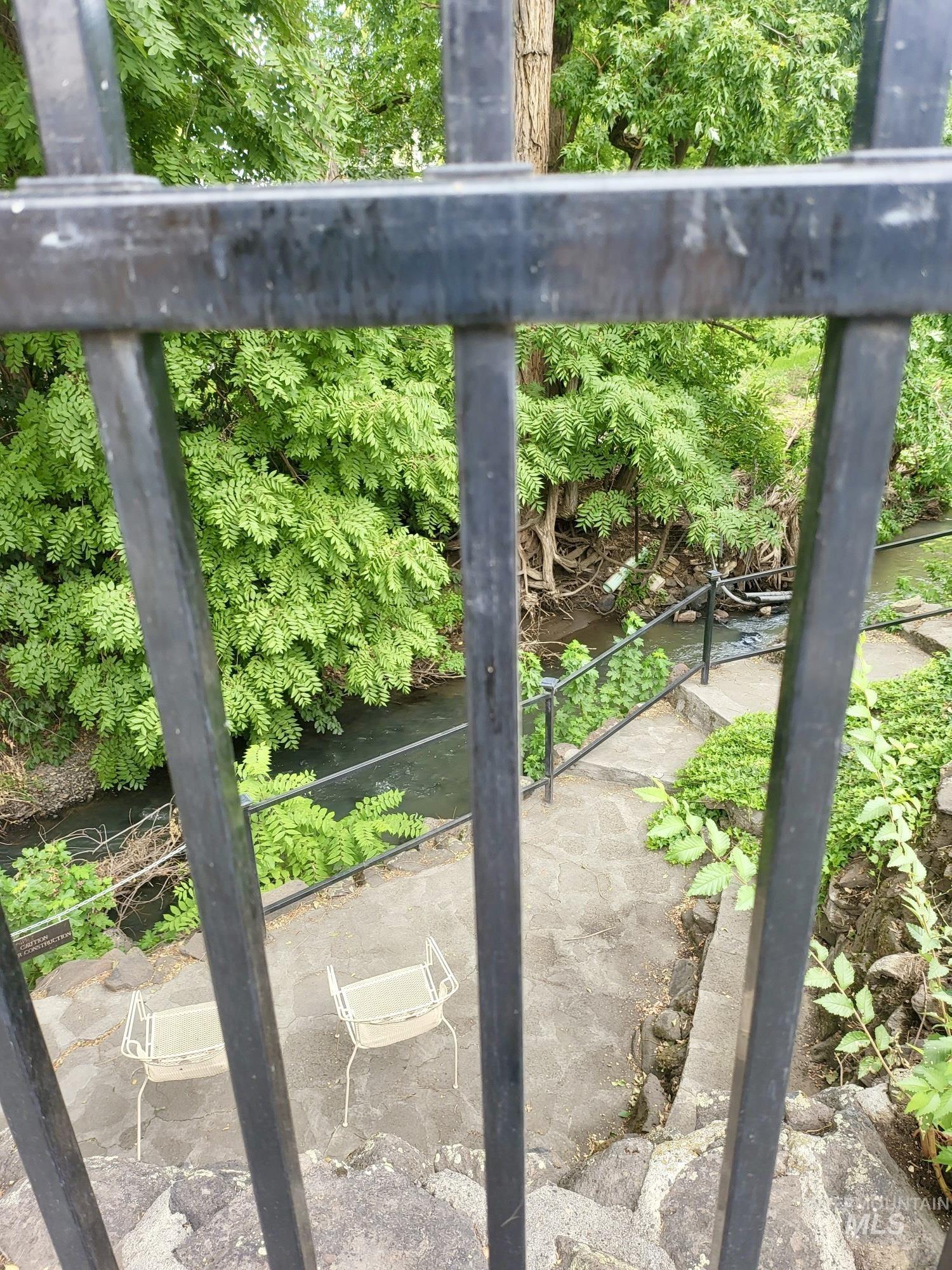 Detailed view looking down to sitting area by creek