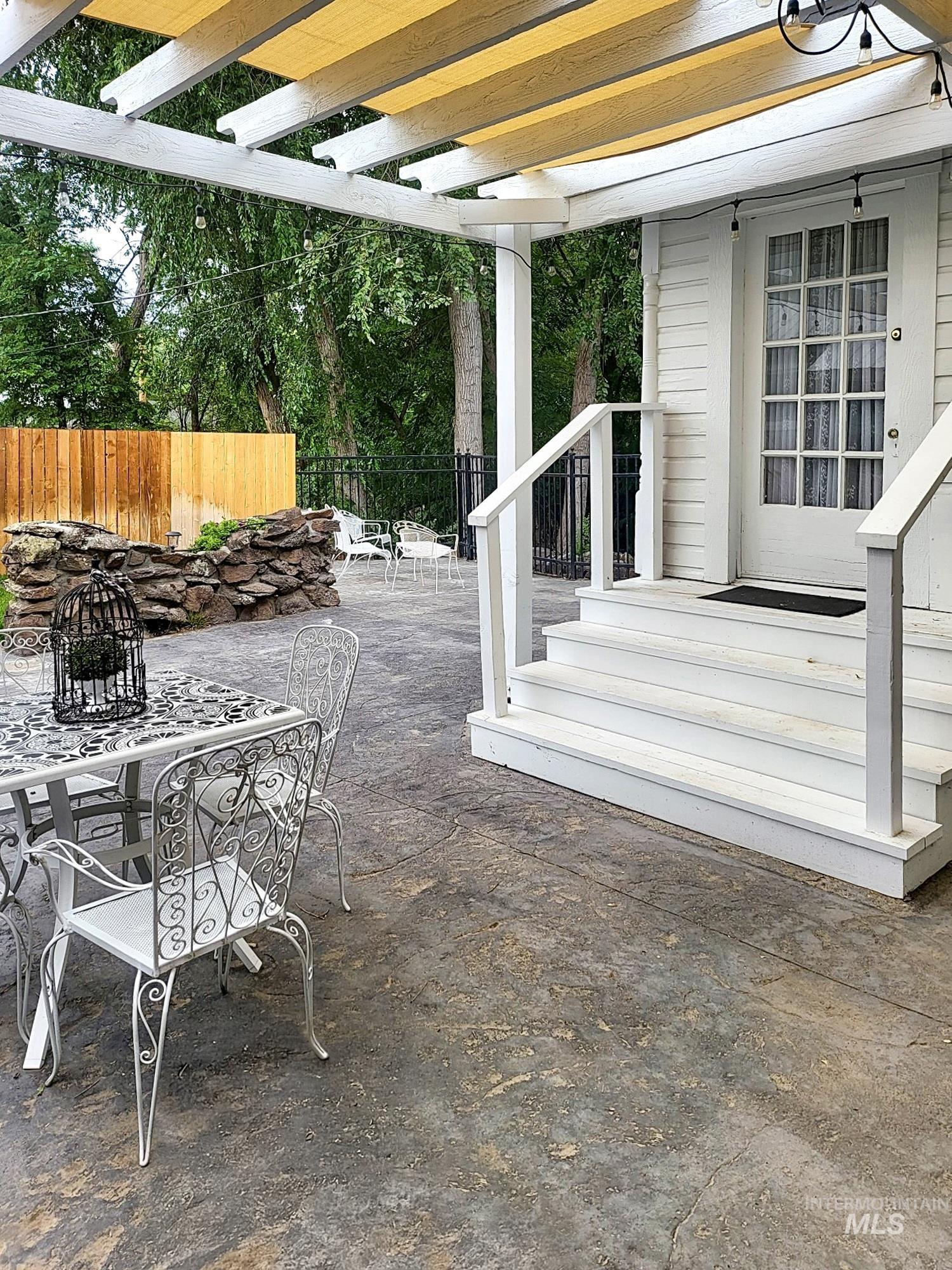 View of patio featuring outdoor dining space.