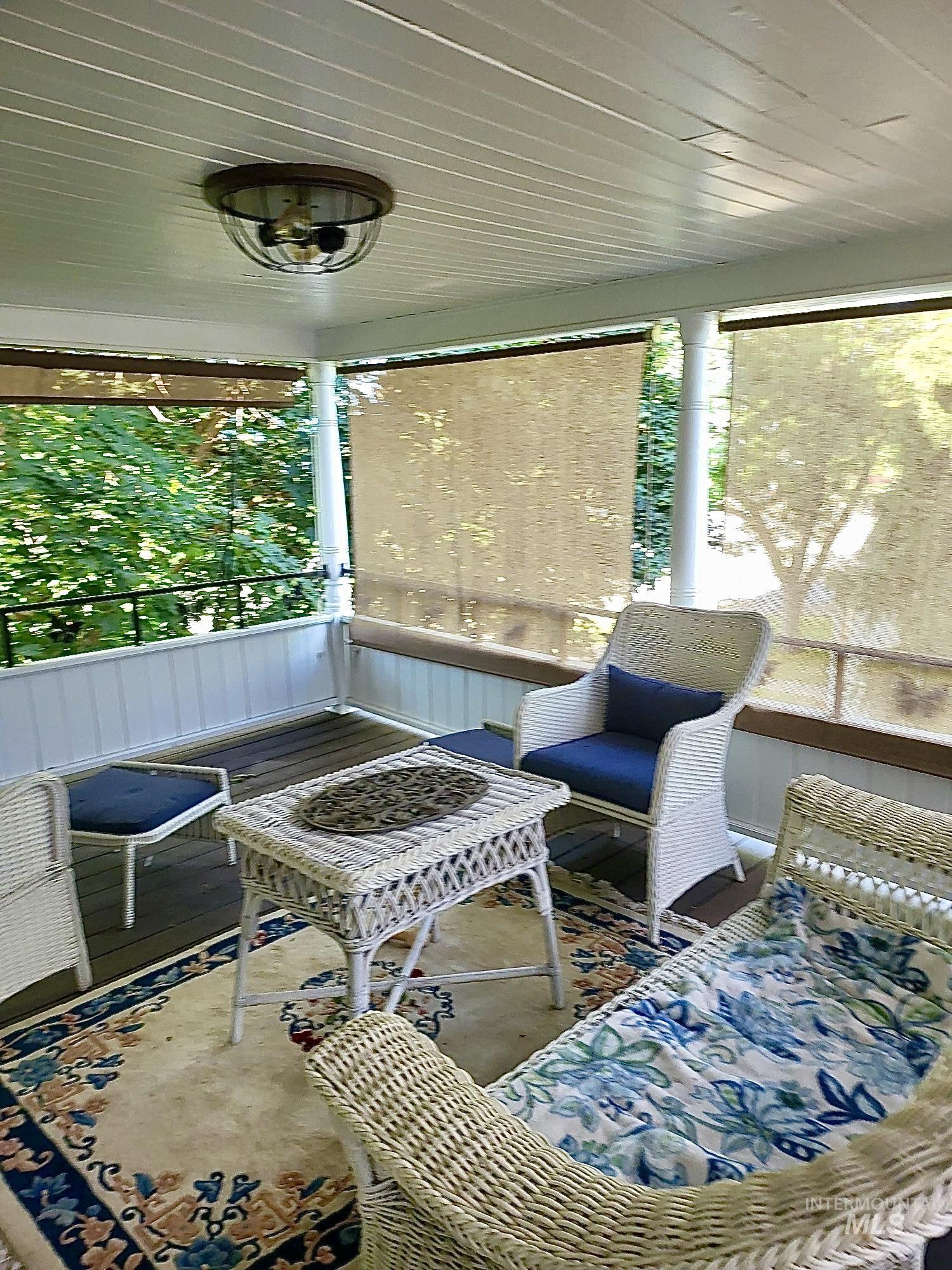 Porch featuring a deck and plenty of natural light and a view