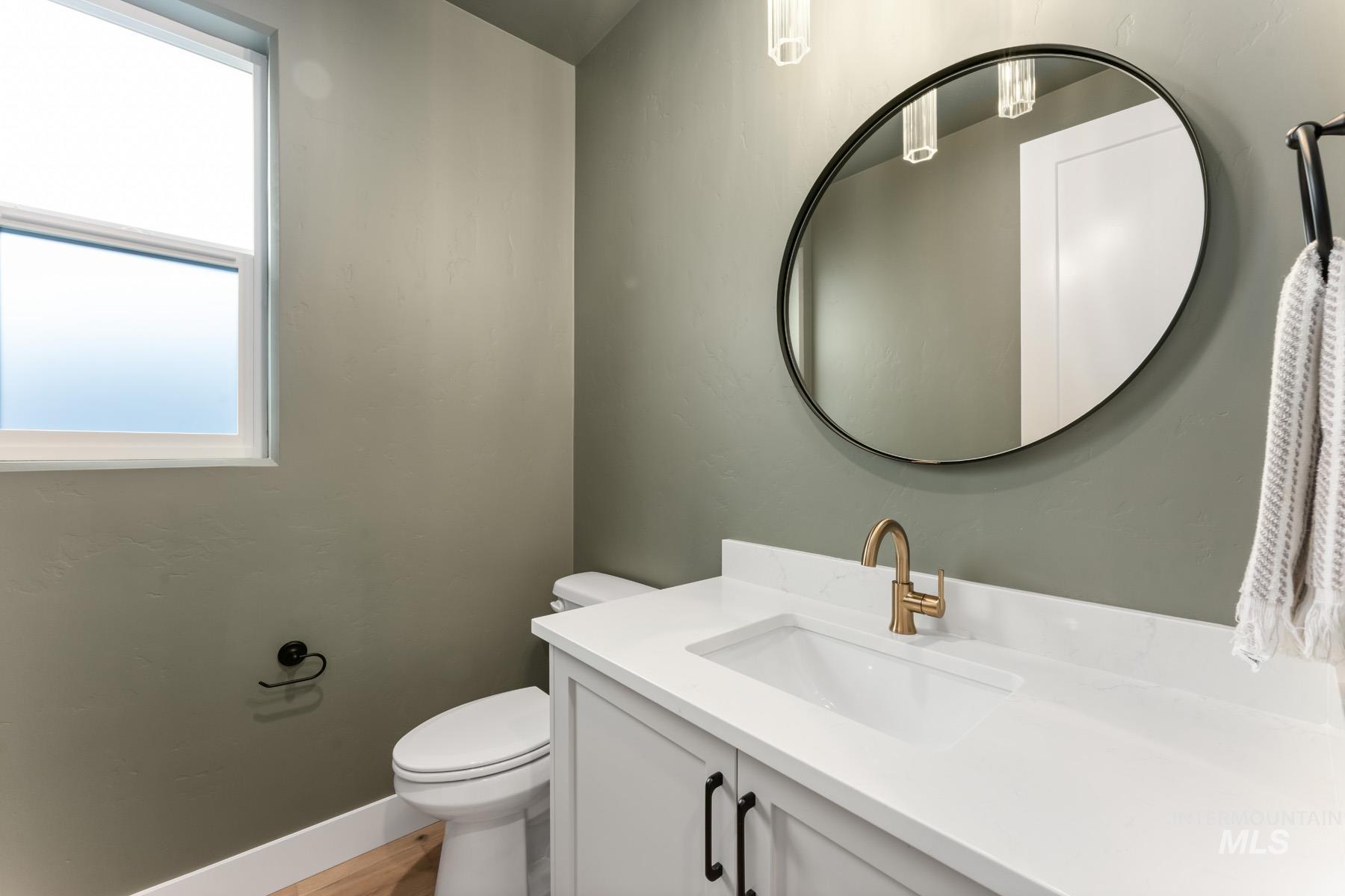 Bathroom featuring vanity and light wood-style floors