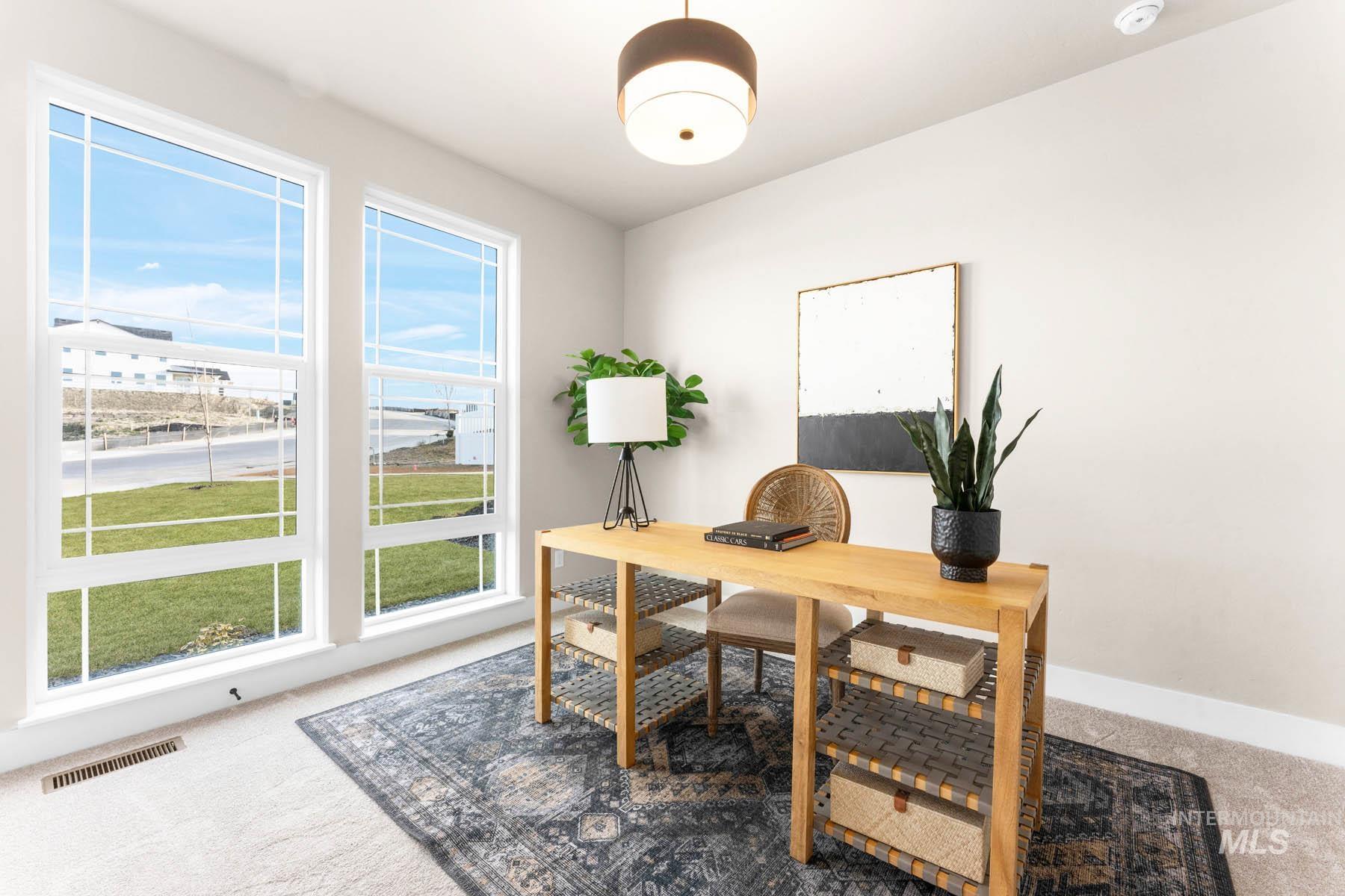 Office space with light colored carpet