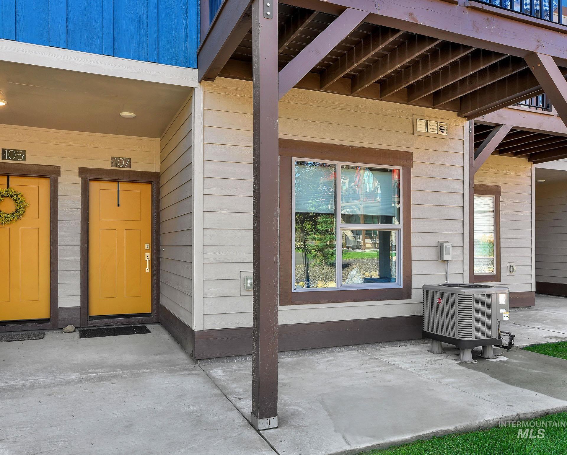 Doorway to property with a patio area