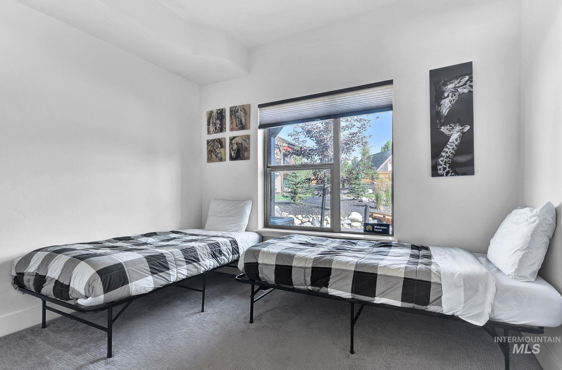 Bedroom featuring baseboards and carpet flooring