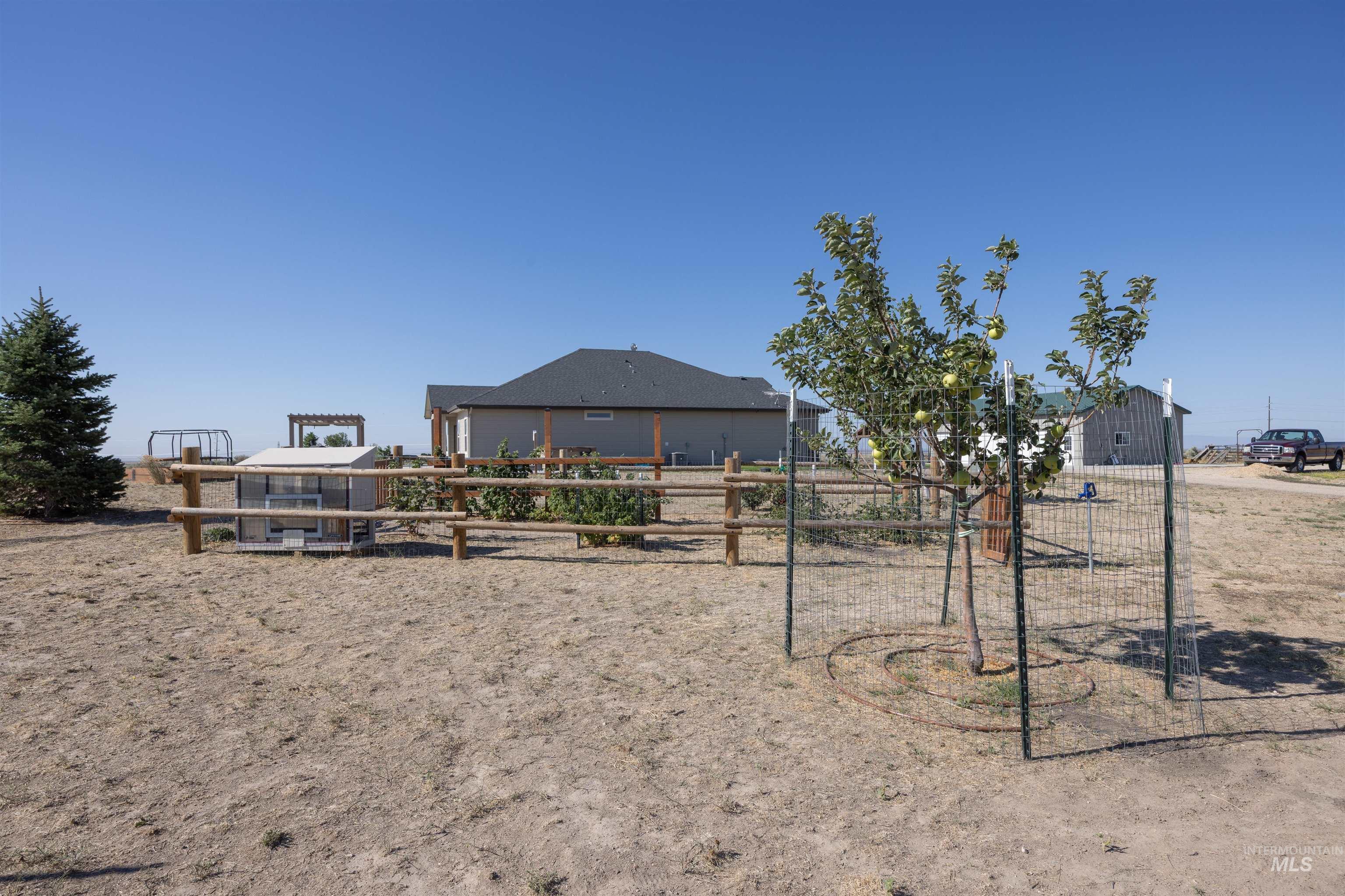View of playground featuring an outbuilding