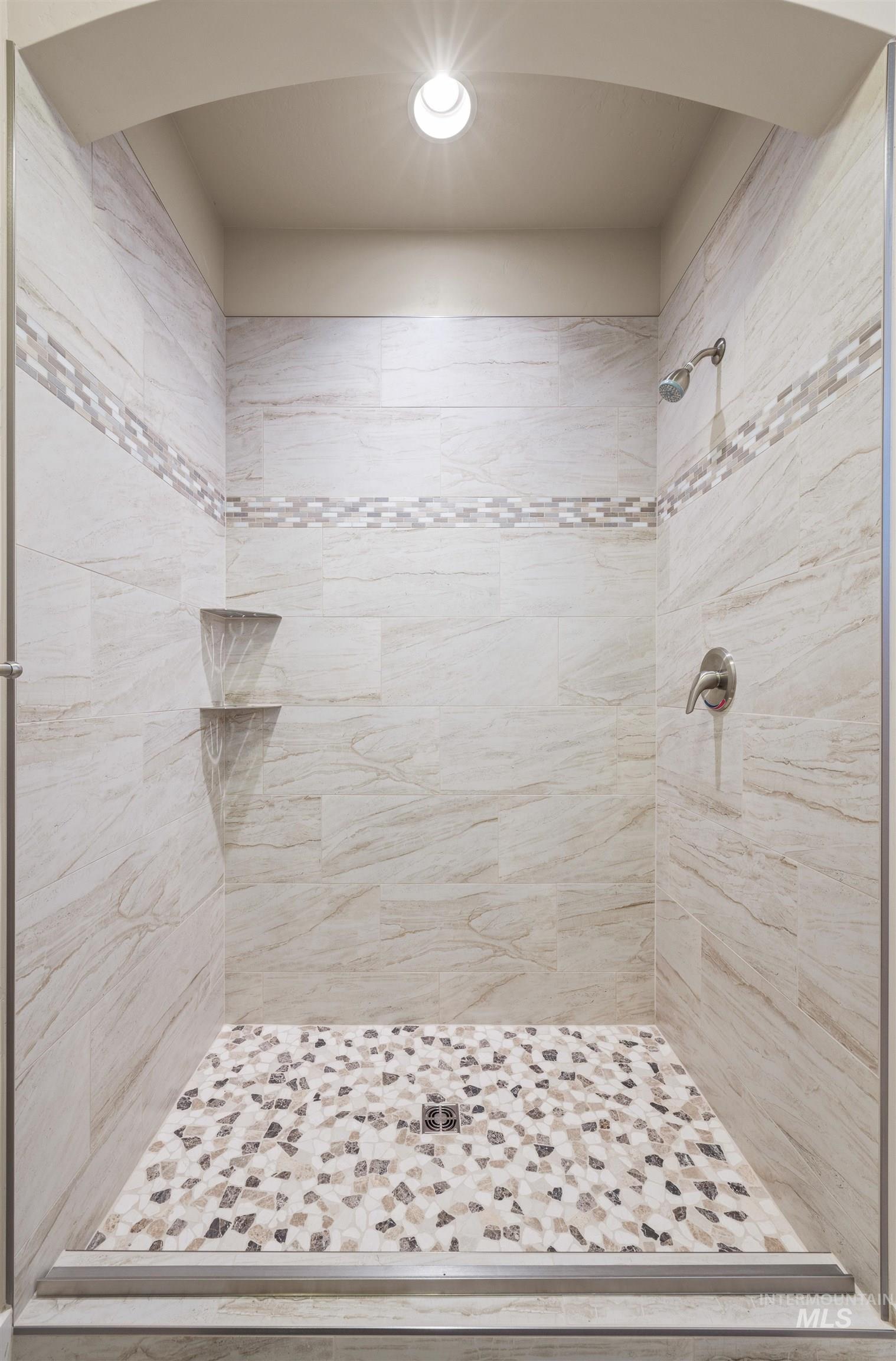 Full bath featuring a shower stall and recessed lighting