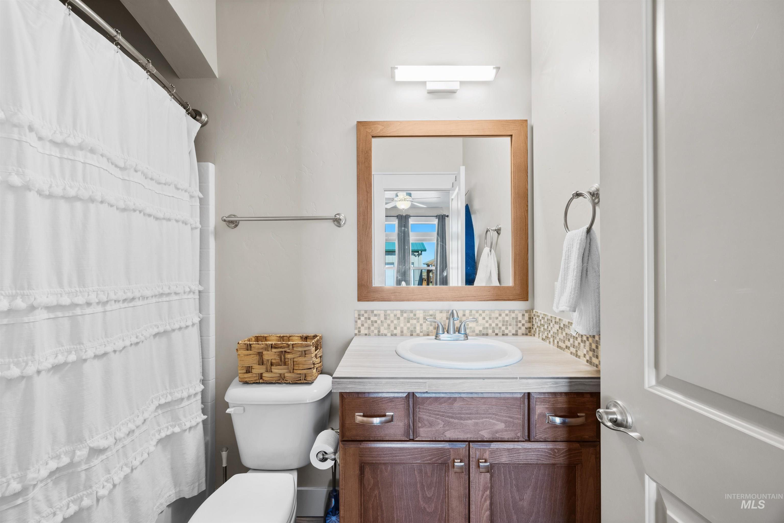 Bathroom with vanity and a shower with curtain