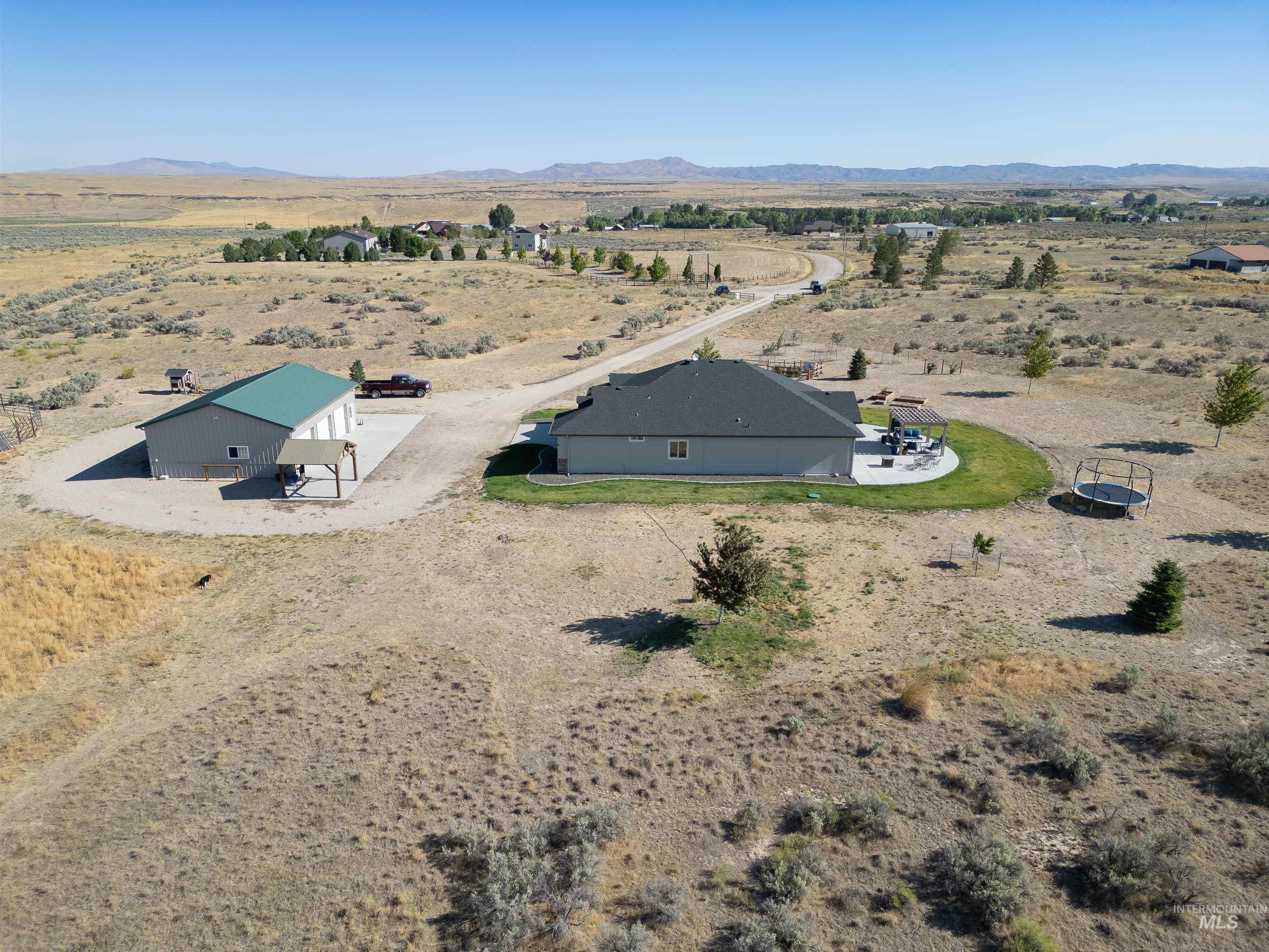 Overview of rural landscape with a desert landscape and a mountainous background