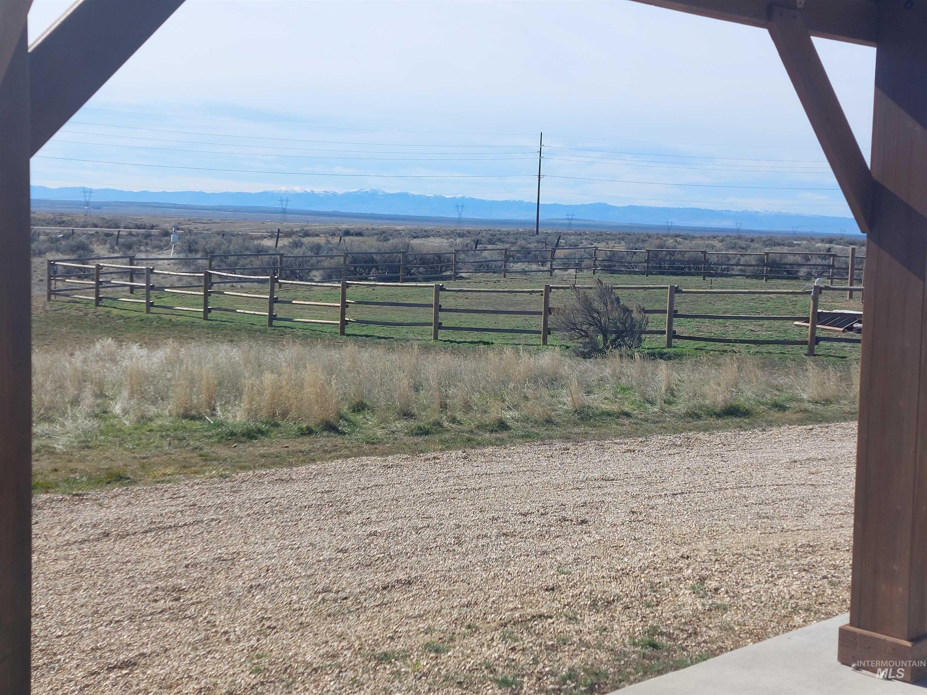 View of yard with a mountain view and a rural view