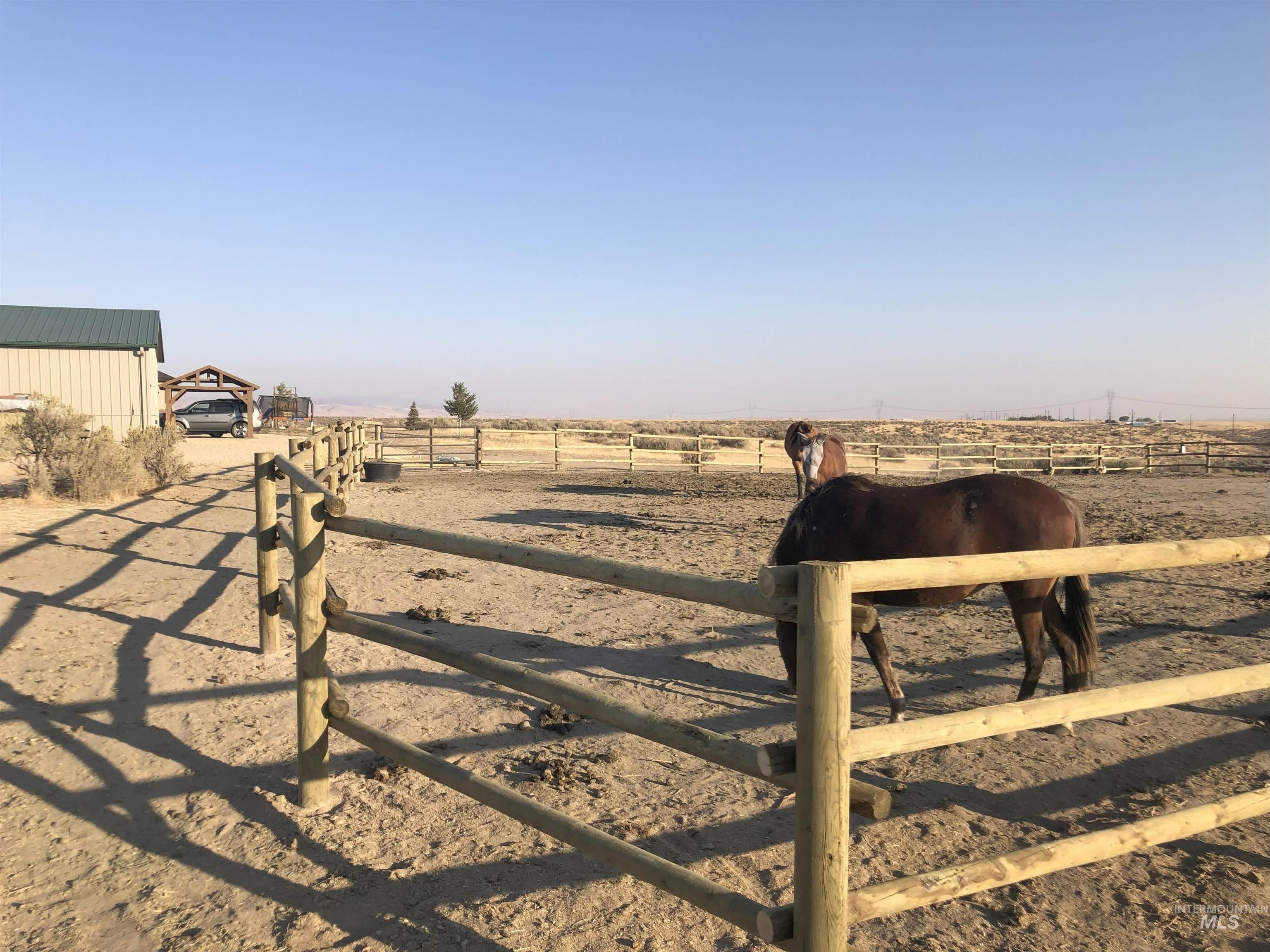 View of yard featuring an outdoor structure and an enclosed horse arena