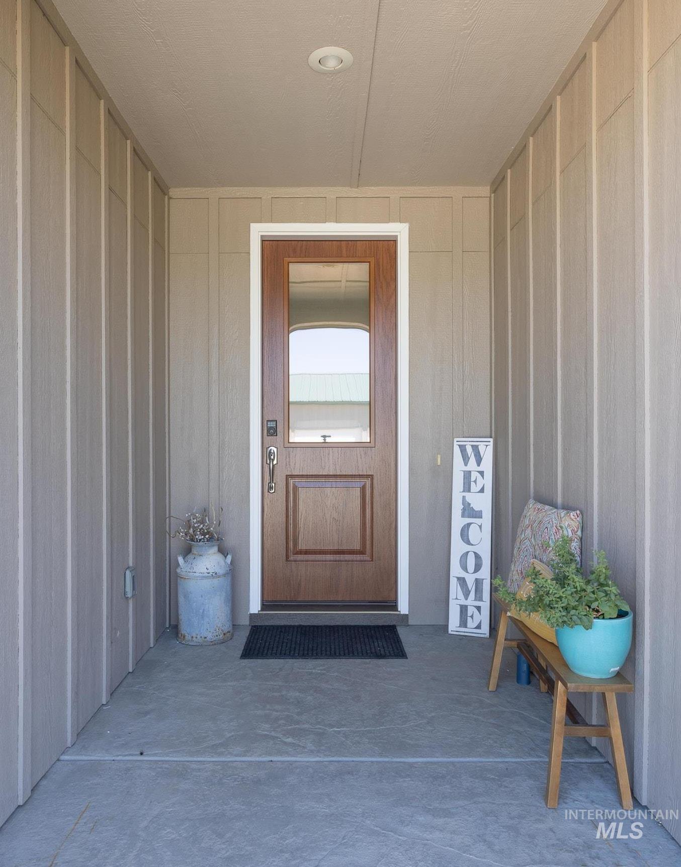 Property entrance featuring covered porch