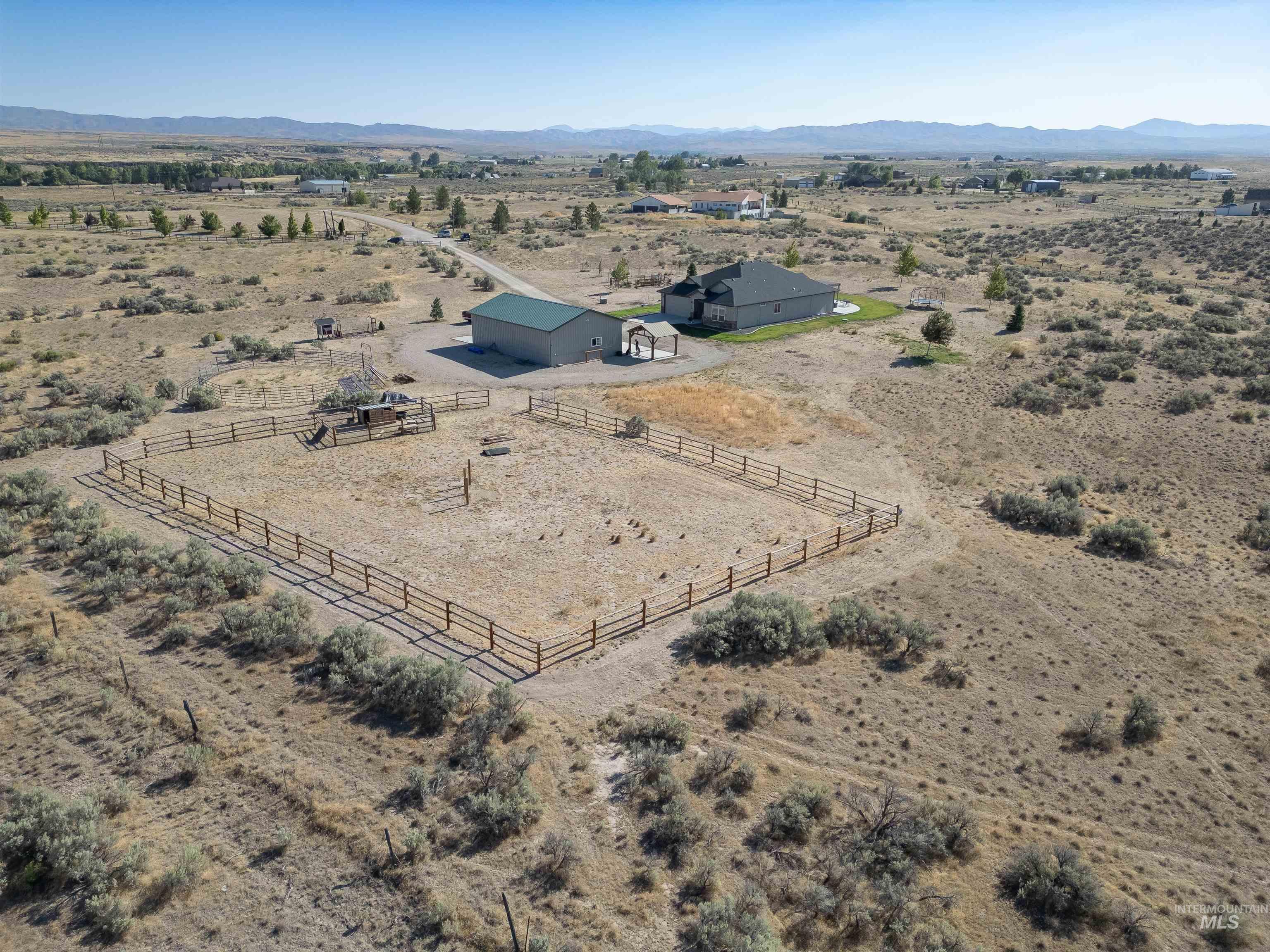 Overview of rural landscape featuring mountains and a desert landscape