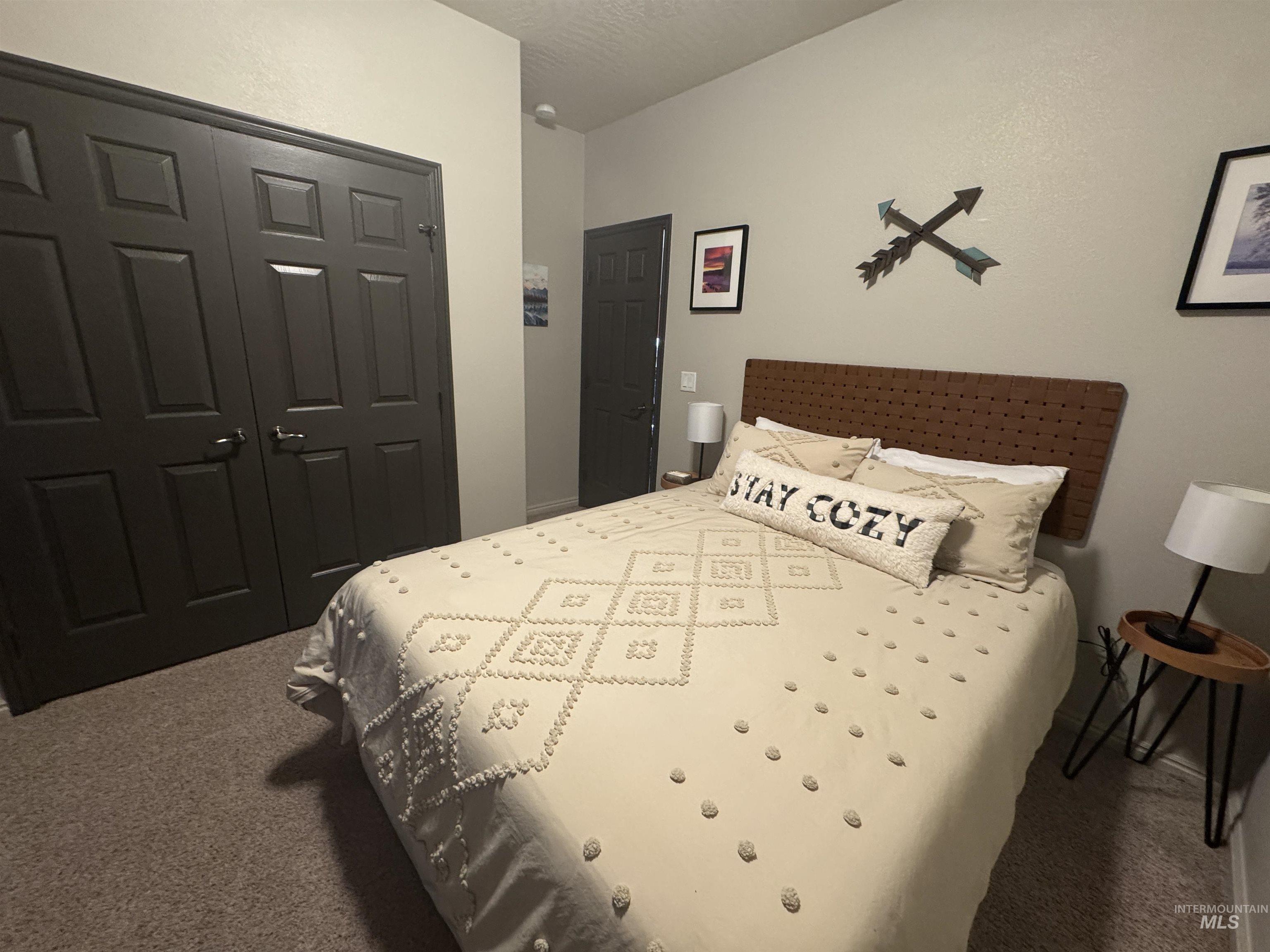 Bedroom with carpet flooring and a closet