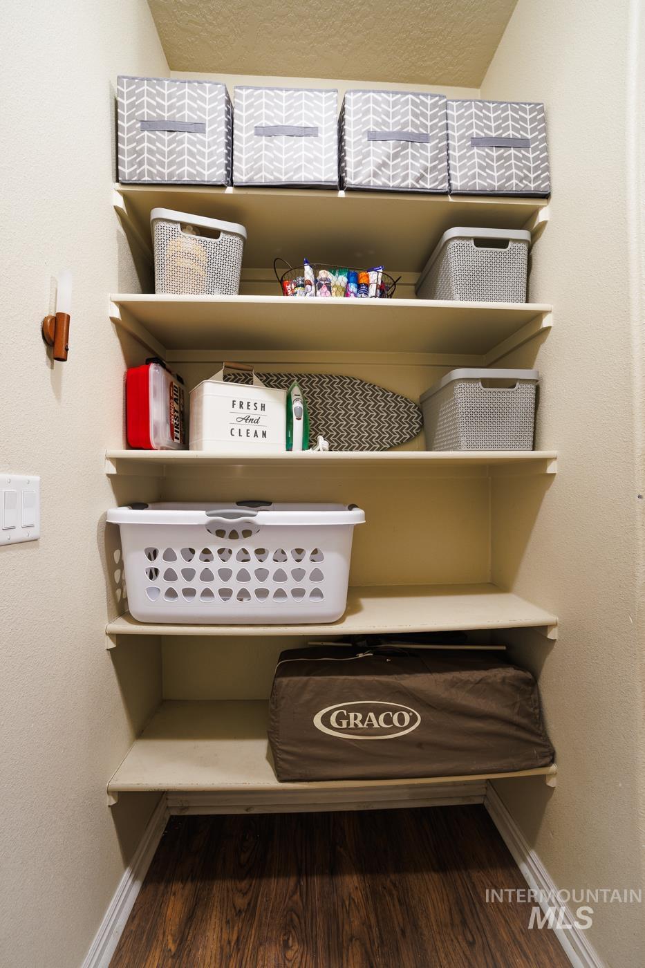 Detailed view of a textured wall and wood finished floors