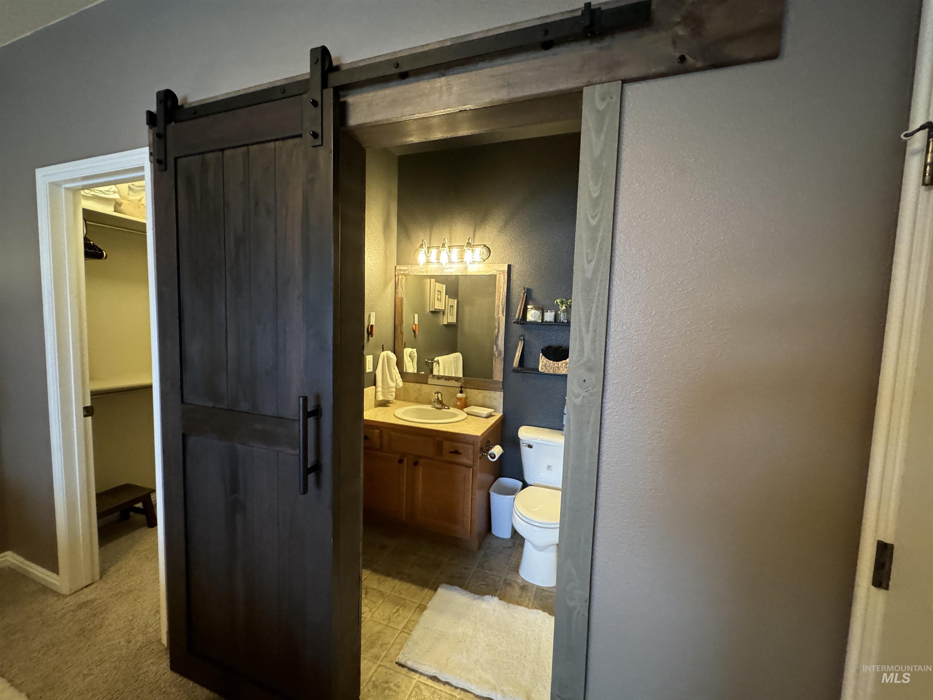 Half bath with vanity and toilet