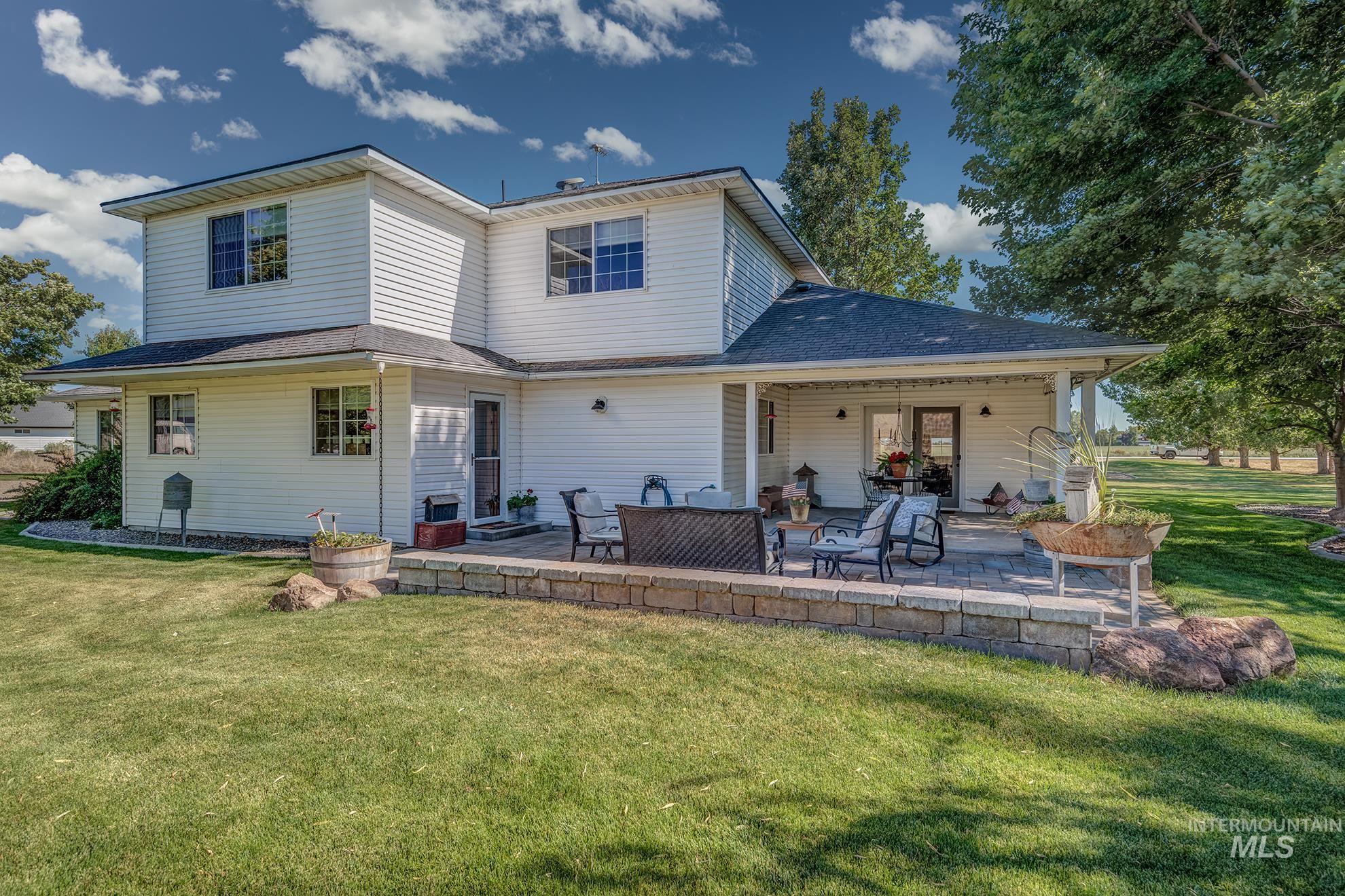 White vinyl siding exterior with a multi-level design