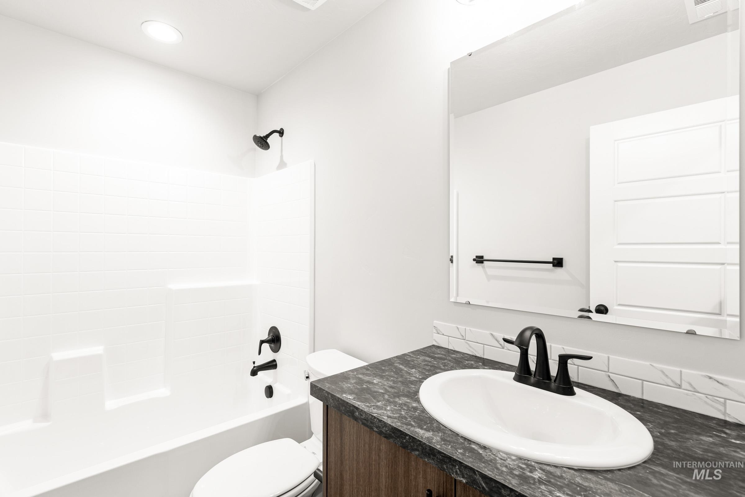 Full bathroom featuring vanity and shower / bath combination