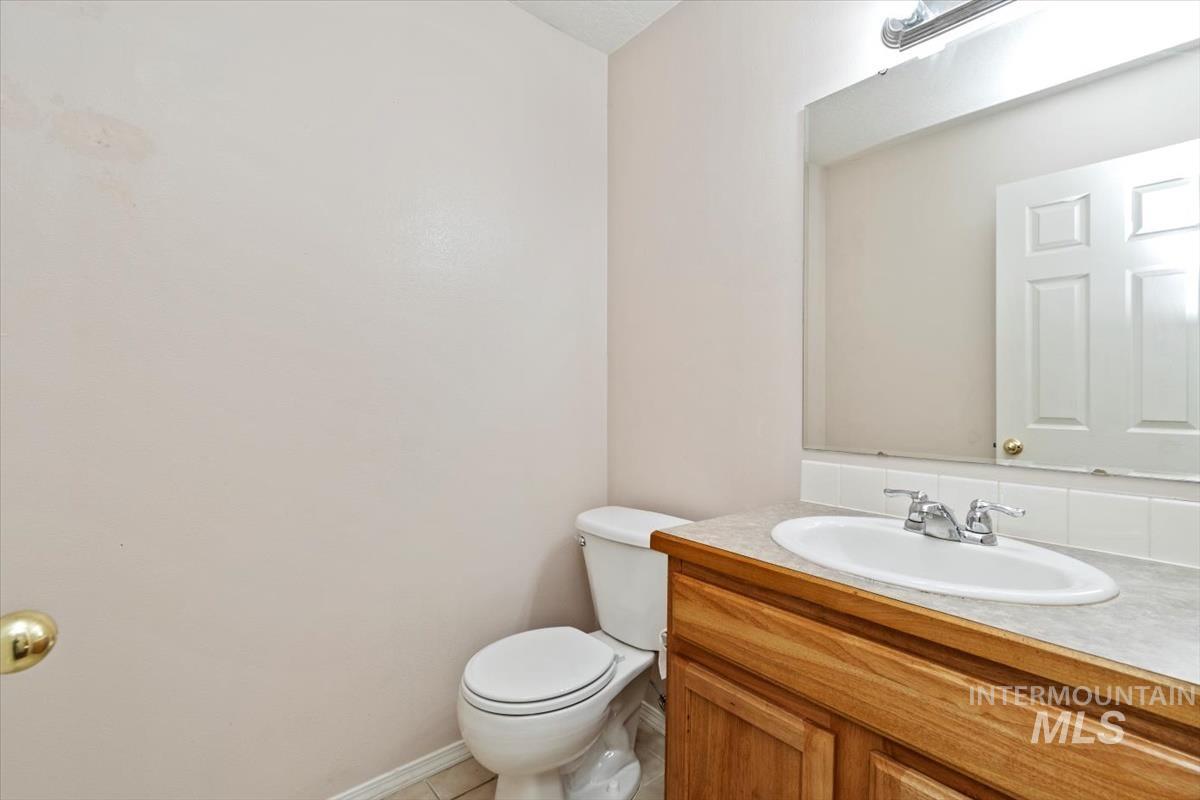 Bathroom featuring vanity and light tile patterned flooring