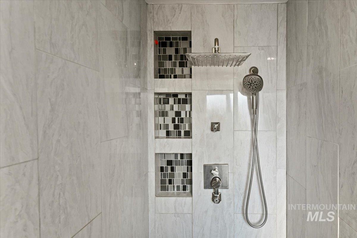 Bathroom view of a tile shower