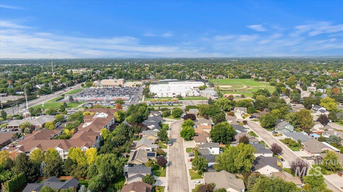 Aerial view of property and high school in the back