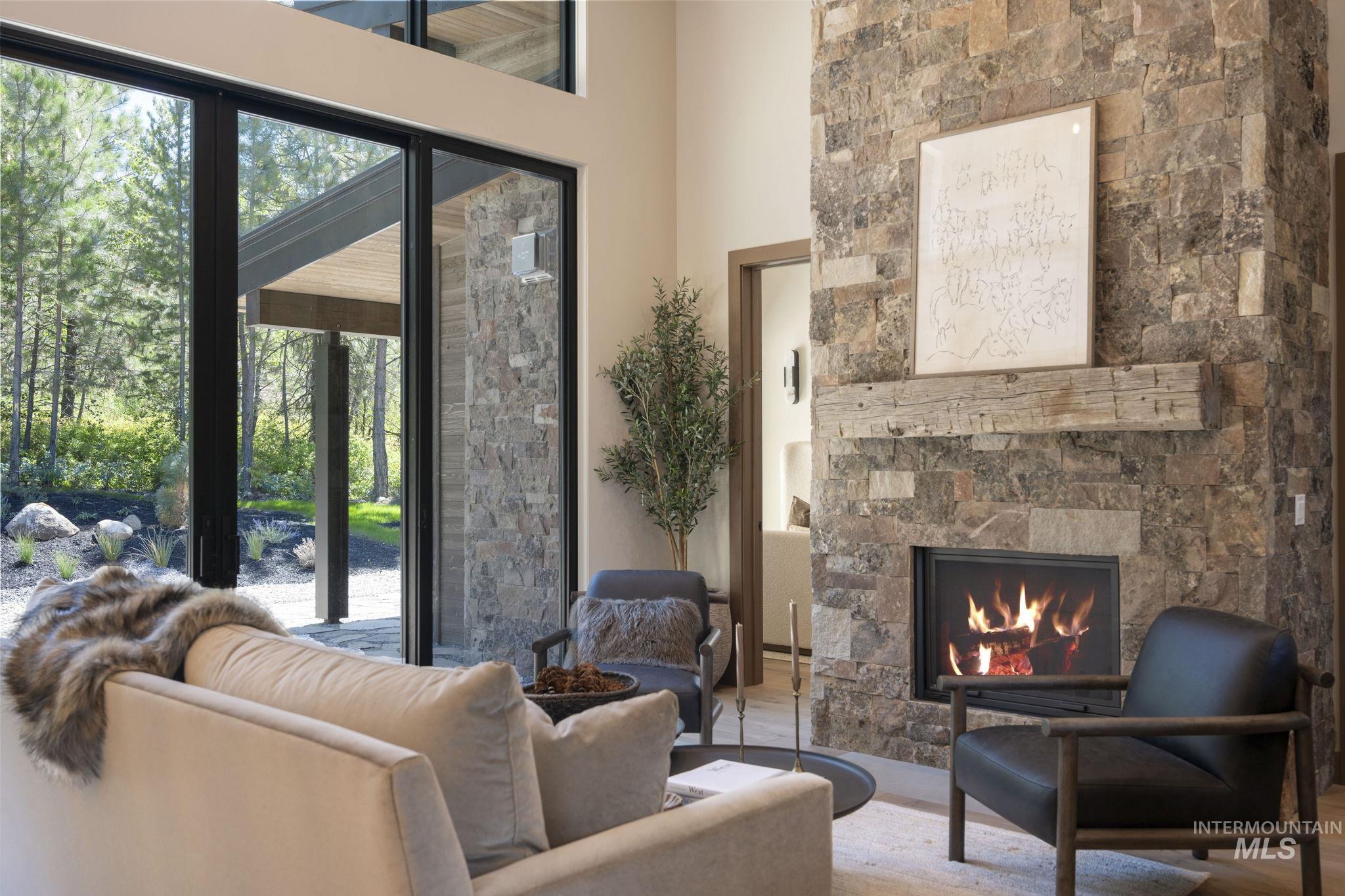 Living room with a fireplace and wood finished floors