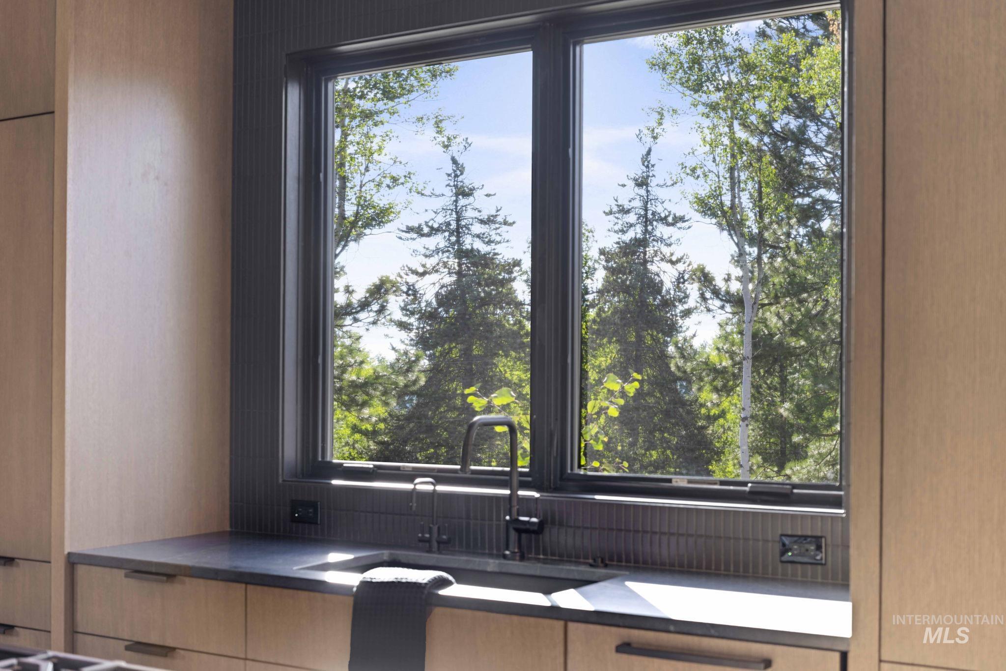 Kitchen with modern cabinets and light brown cabinetry