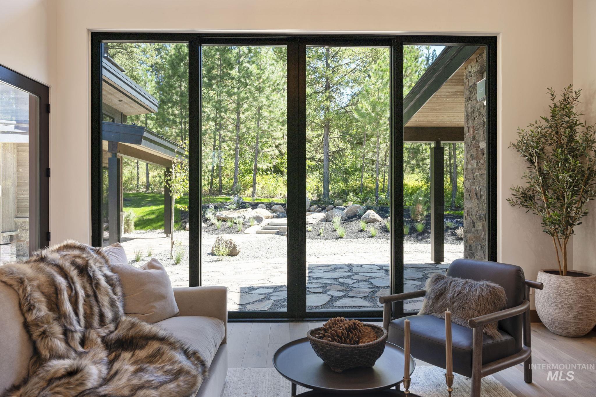 Doorway to outside with hardwood / wood-style flooring and view of scattered trees