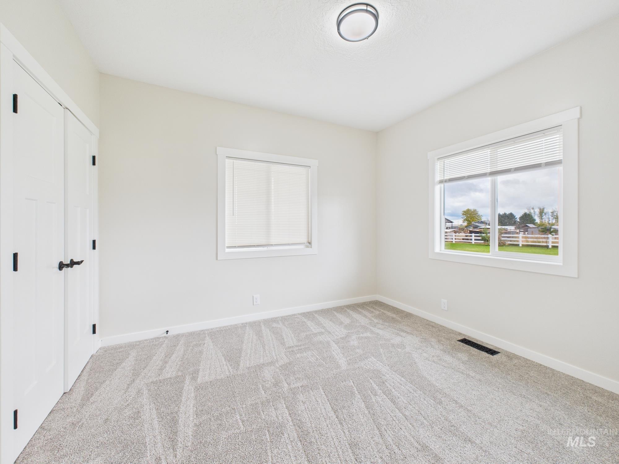 Unfurnished bedroom featuring a closet and carpet