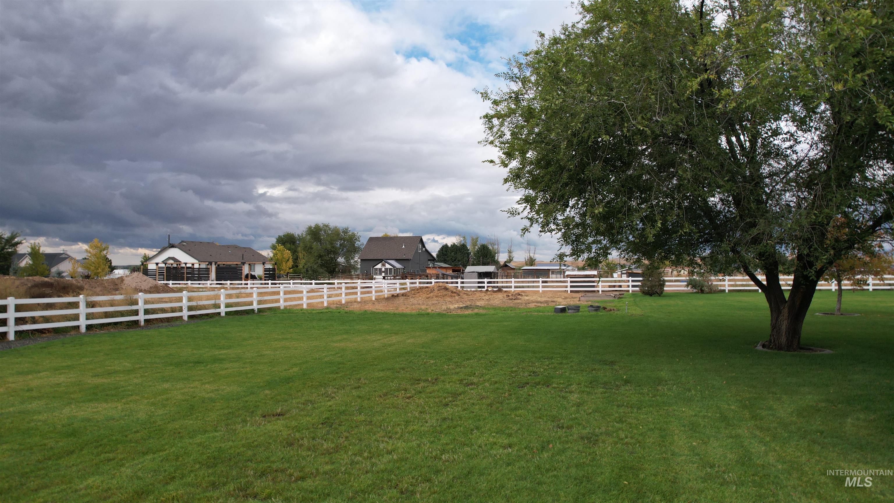 View of yard featuring an enclosed riding area